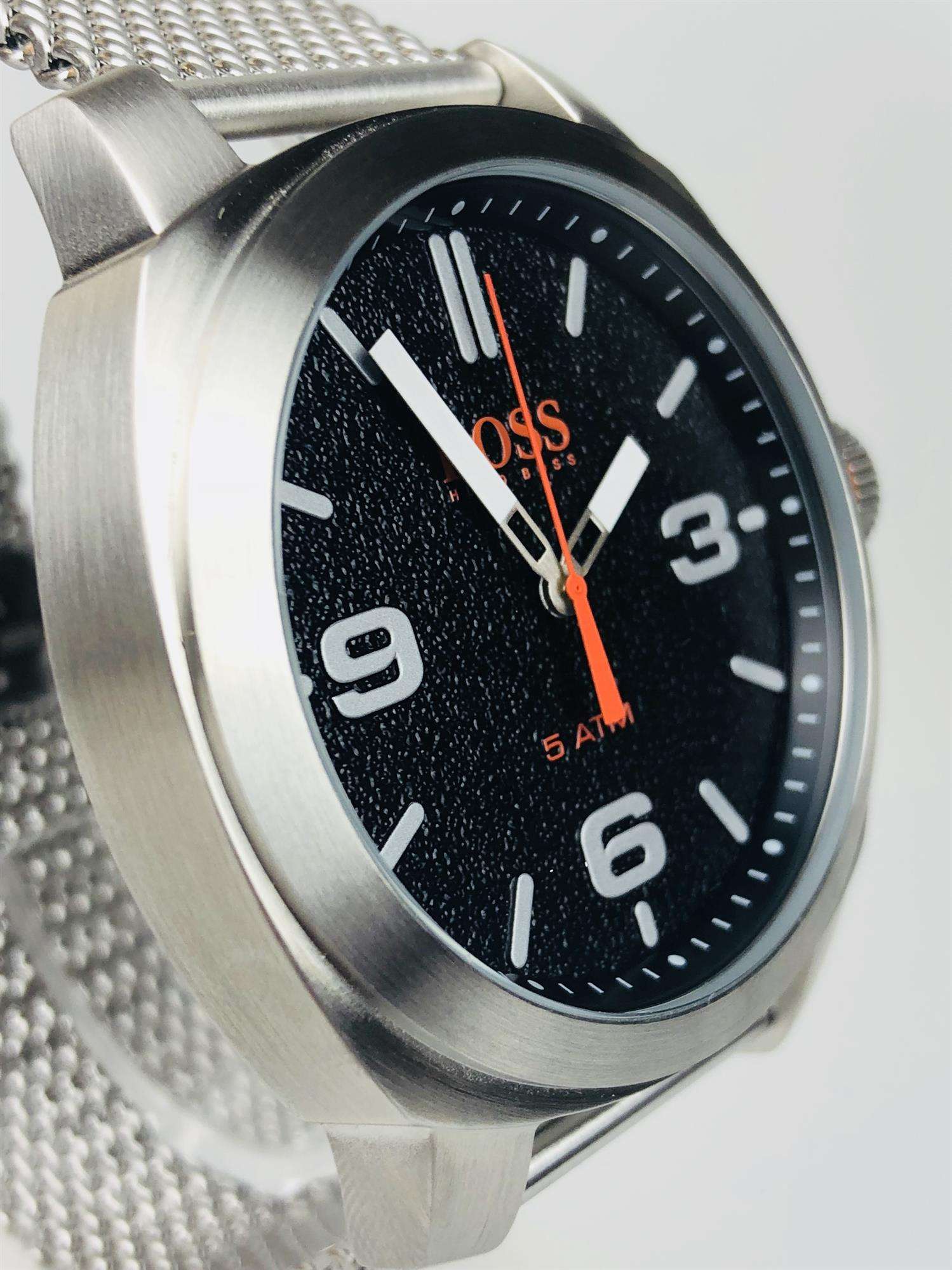 The Watch: Hugo Boss Orange Cape Town Stainless Steel Mesh Strap Stainless Steel Case Men’s Watch 1550013In a homage to the mountainous city from which it takes its name, this Hugo Boss Orange Cape Town Stainless Steel Men’s Watch (1550013) features a confident stainless steel mesh bracelet and case, with a sleek and contemporary dial design ensuring this sense of adventure is underpinned by the Hugo Boss design ethos. Key Features:Quartz MovementBlack DialStainless Steel Mesh BraceletWater Resistant t
