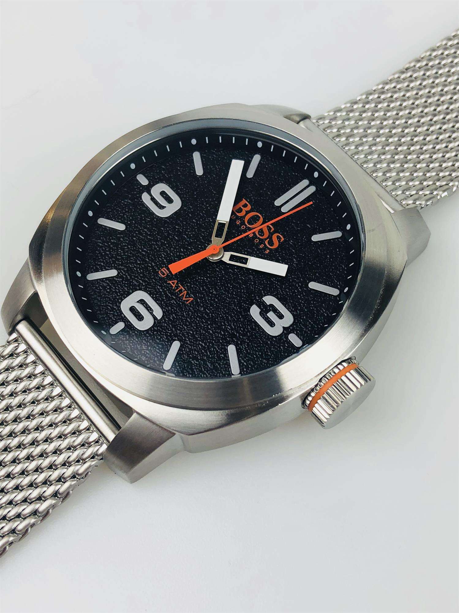 The Watch: Hugo Boss Orange Cape Town Stainless Steel Mesh Strap Stainless Steel Case Men’s Watch 1550013In a homage to the mountainous city from which it takes its name, this Hugo Boss Orange Cape Town Stainless Steel Men’s Watch (1550013) features a confident stainless steel mesh bracelet and case, with a sleek and contemporary dial design ensuring this sense of adventure is underpinned by the Hugo Boss design ethos. Key Features:Quartz MovementBlack DialStainless Steel Mesh BraceletWater Resistant t