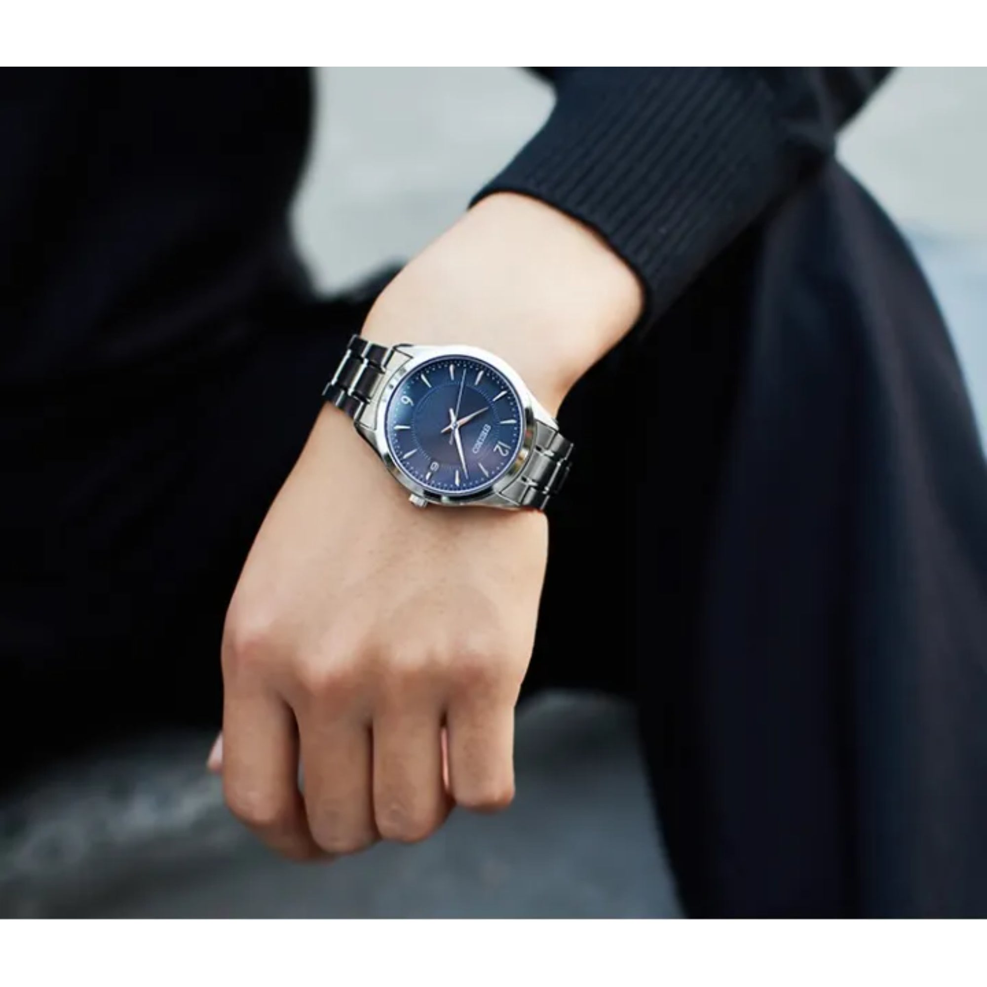 Seiko Essentials blue sunburst dial slim stainless steel quartz watch on wrist