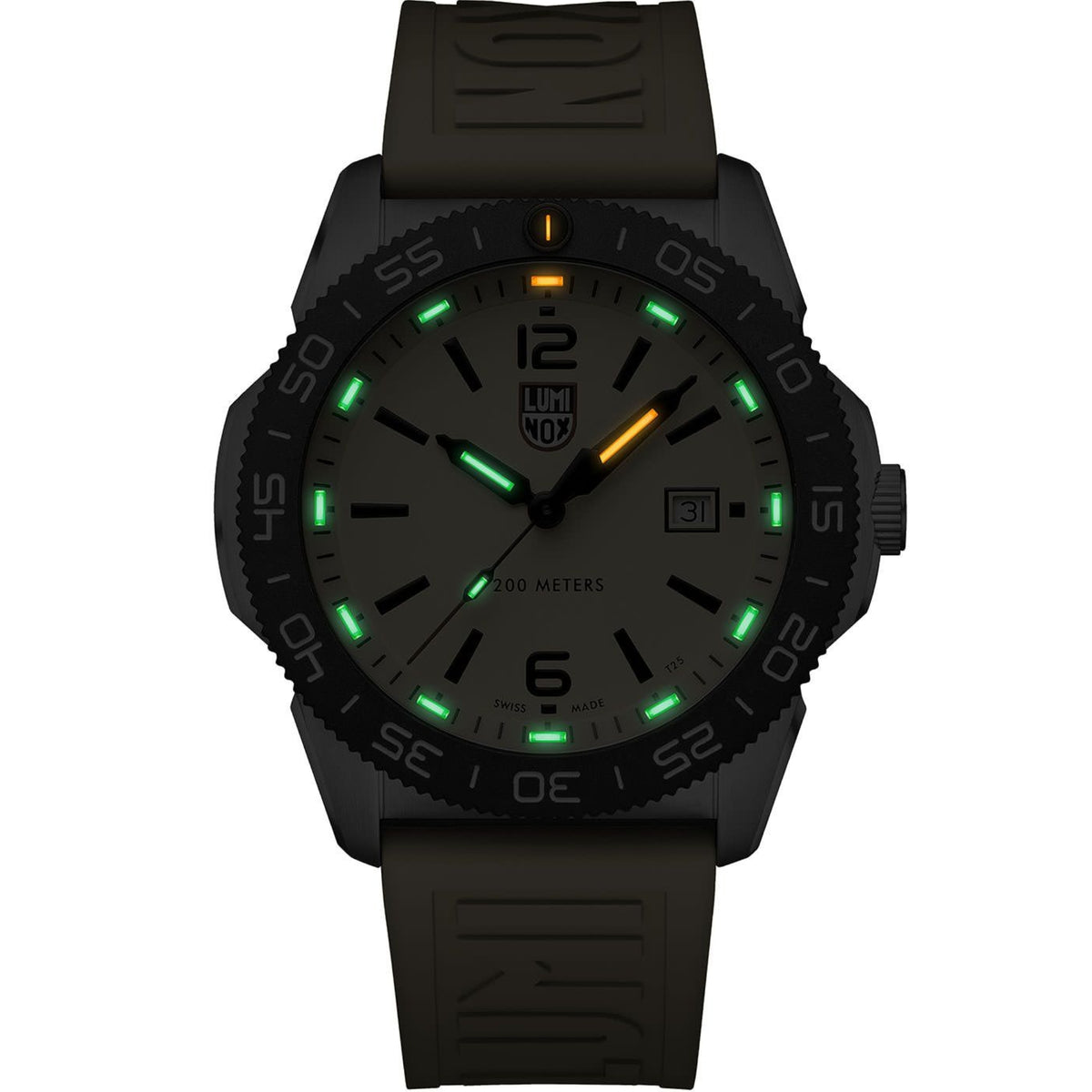 Luminox Pacific Diver 3120 Series XS.3125 mens watch in low light displaying green and orange illuminated gas tubes on yellow dial