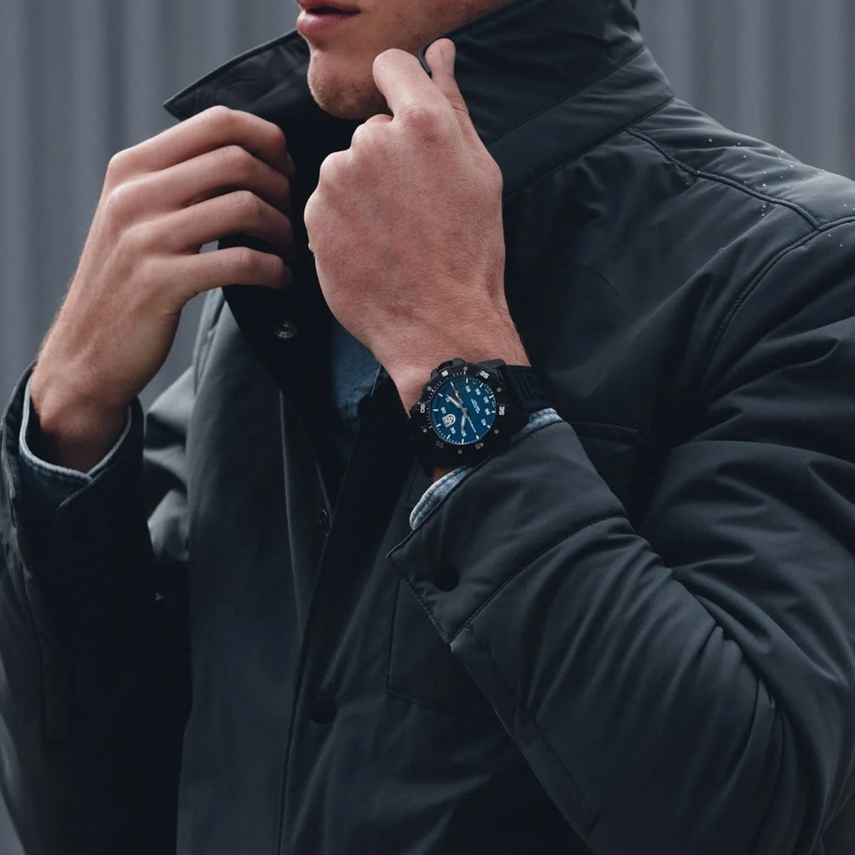 Luminox Master Carbon SEAL XS.3863 blue dial automatic watch model shot view showing the black carbon case and blue rubber strap worn on wrist