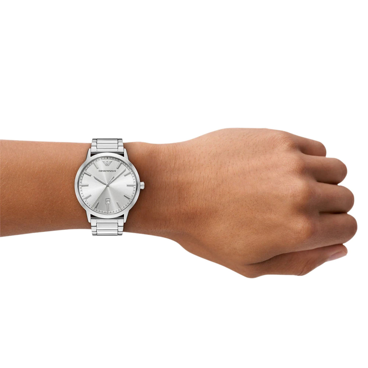 Men's silver steel quartz watch with white dial and metal link bracelet on wrist.