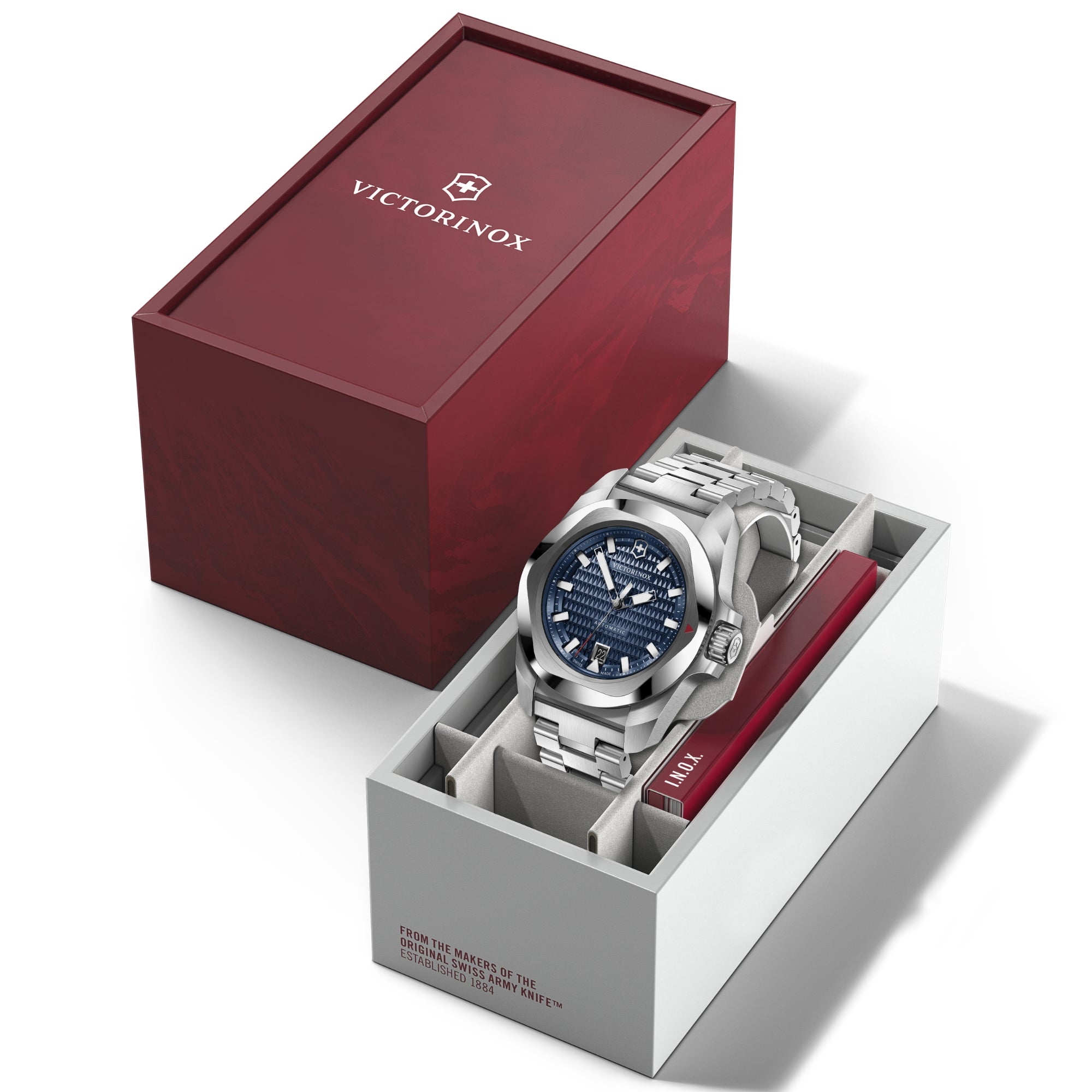 Victorinox I.N.O.X. blue dial automatic steel watch displayed in premium red and white gift box packaging