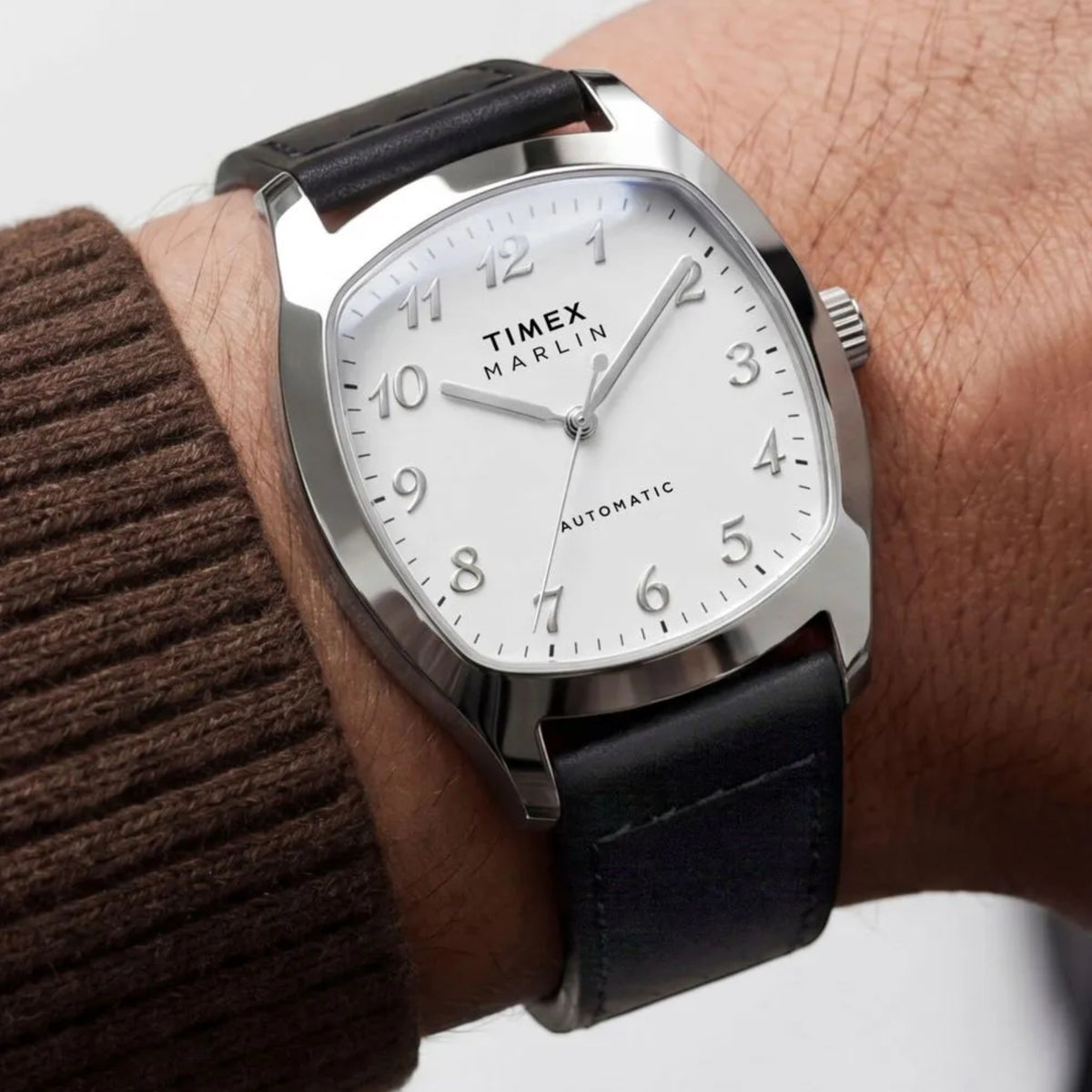 Timex Marlin Chatham TW2Y84300 wrist view showing white dial automatic watch styled on person wearing leather strap