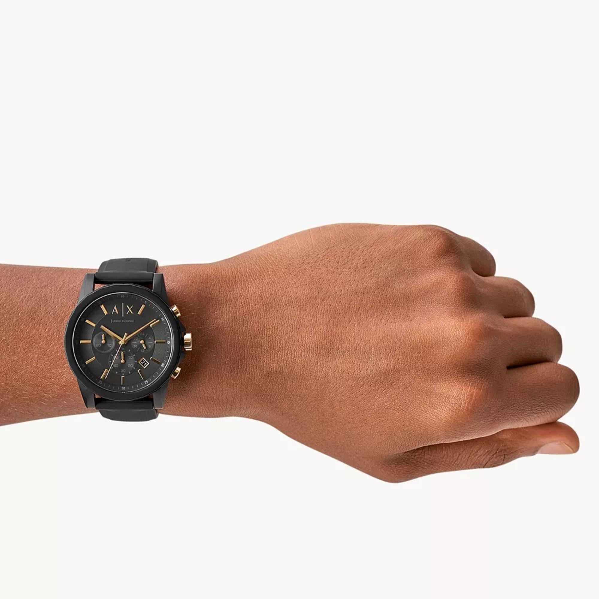 Armani Exchange Outerbanks AX7105 black dial chronograph watch on wrist with black silicone strap.