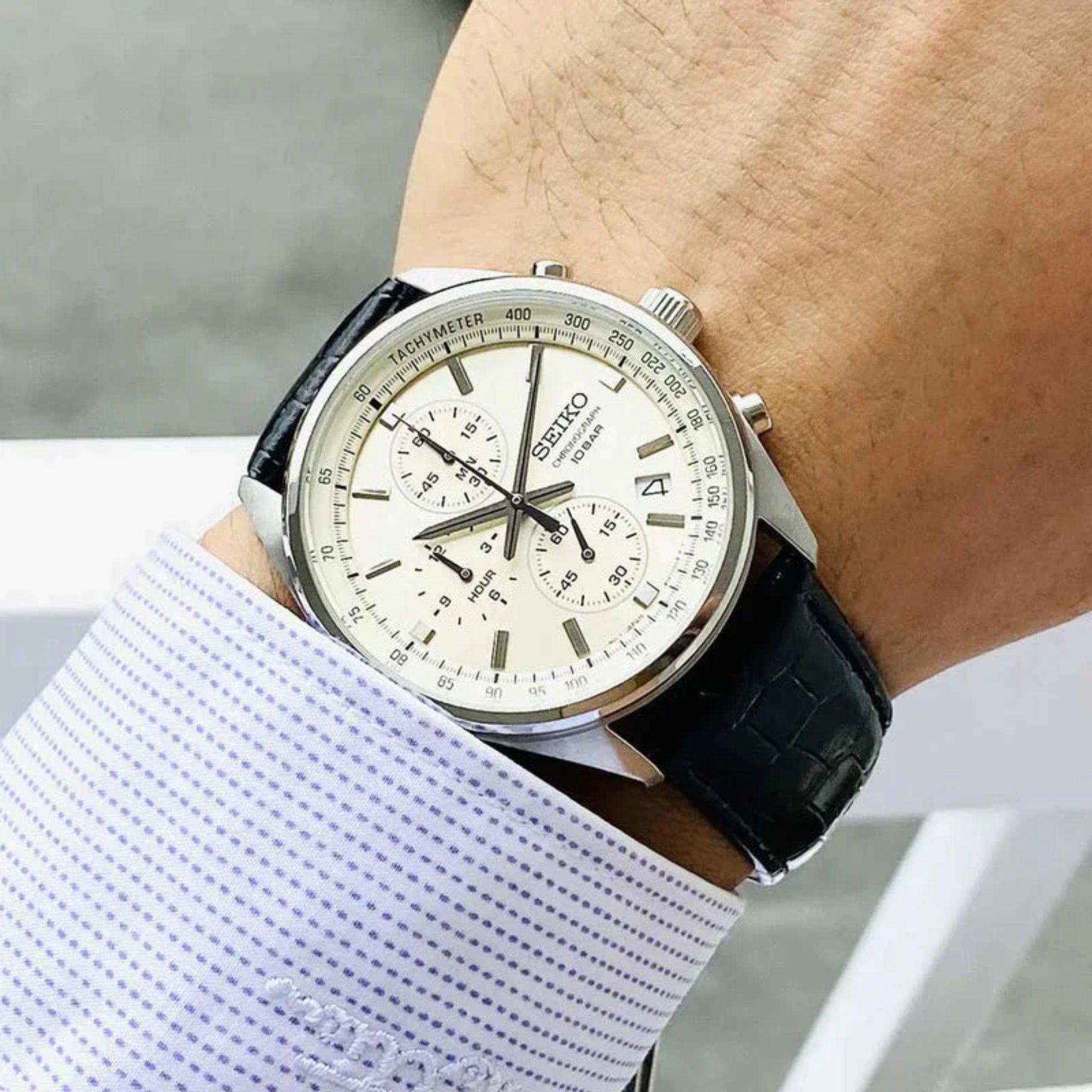Seiko SSB383P1 cream dial chronograph watch worn on wrist with black leather strap