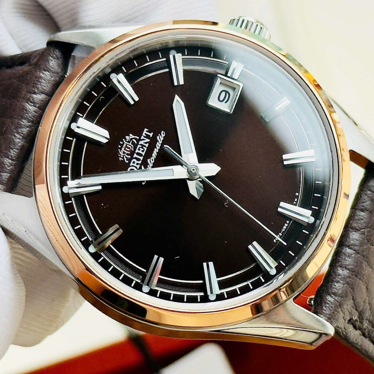 Close-up of the Orient Stretto dress watch with a brown dial