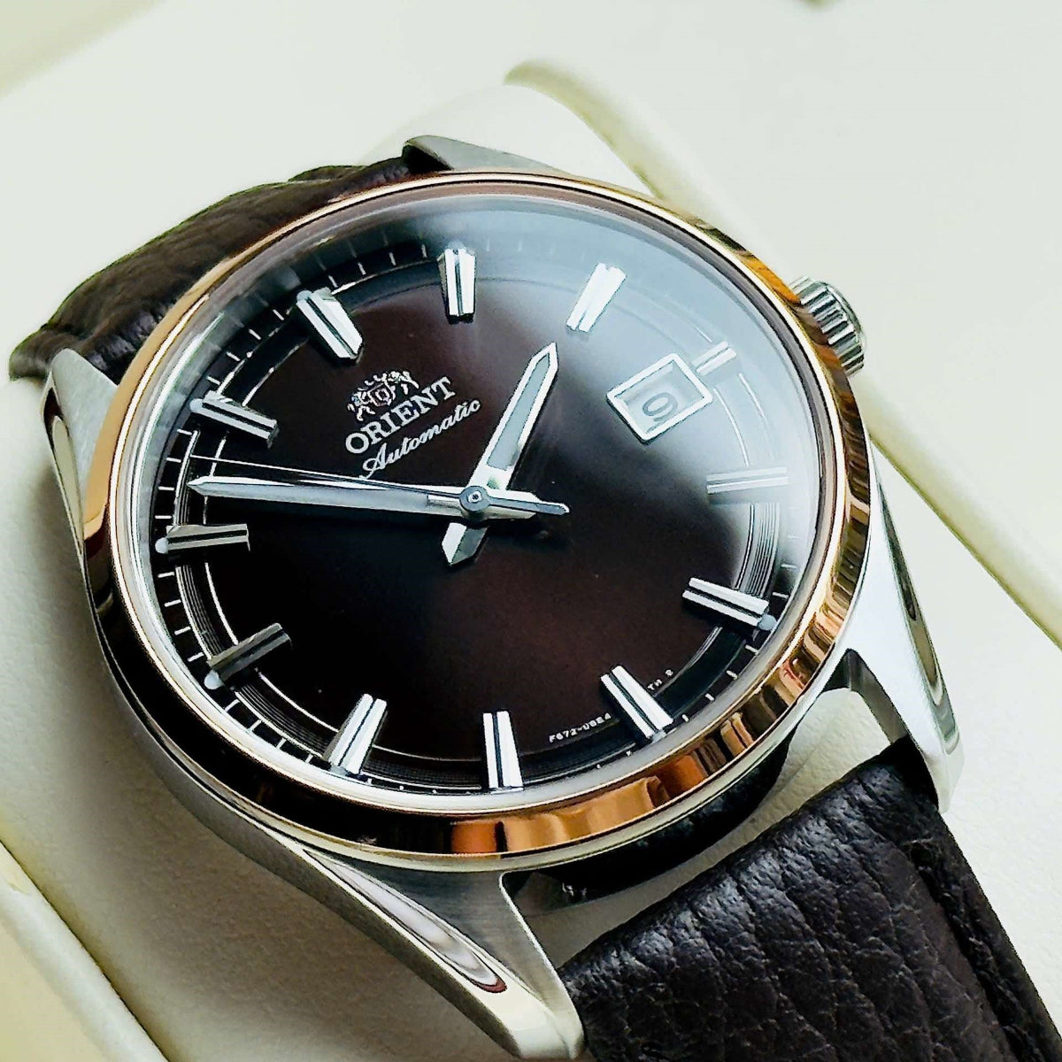 Close-up of the Orient Stretto 38.5mm RA-AC0R03Y30B dress watch with a brown dial