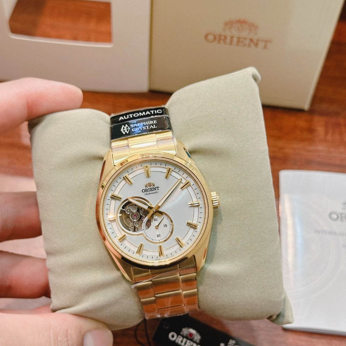 Orient RA-AR0007S30B automatic watch displayed on cushion with box