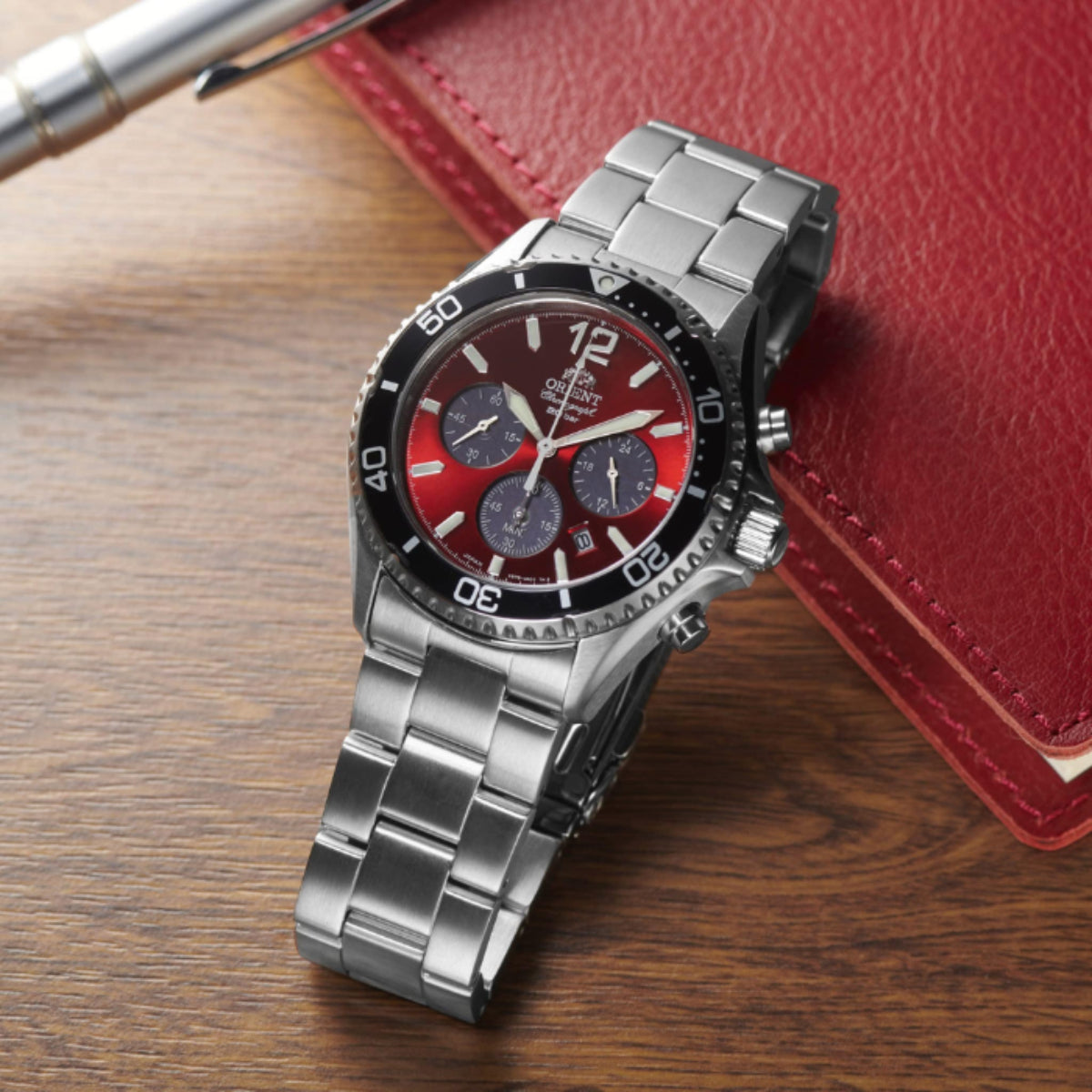 Orient Mako RA-TX0207R10B 43mm red dial chronograph watch side profile with steel bracelet
