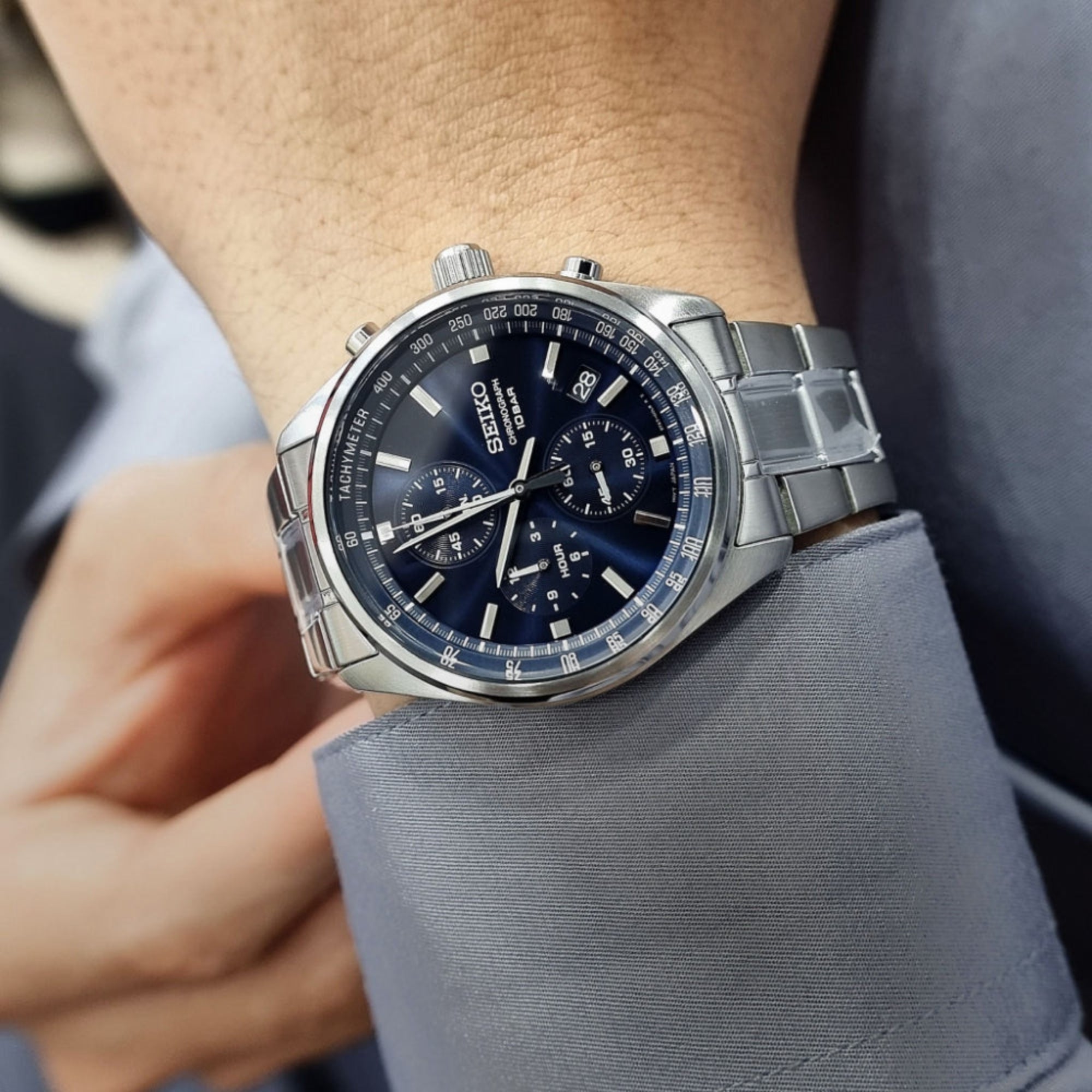 Seiko Essentials SSB377P1 blue dial chronograph on wrist close-up