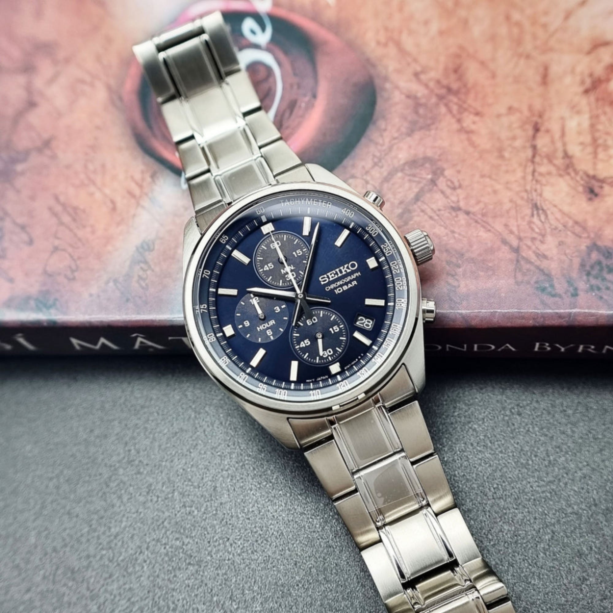 Seiko SSB377P1 blue dial chronograph watch placed on decorative book