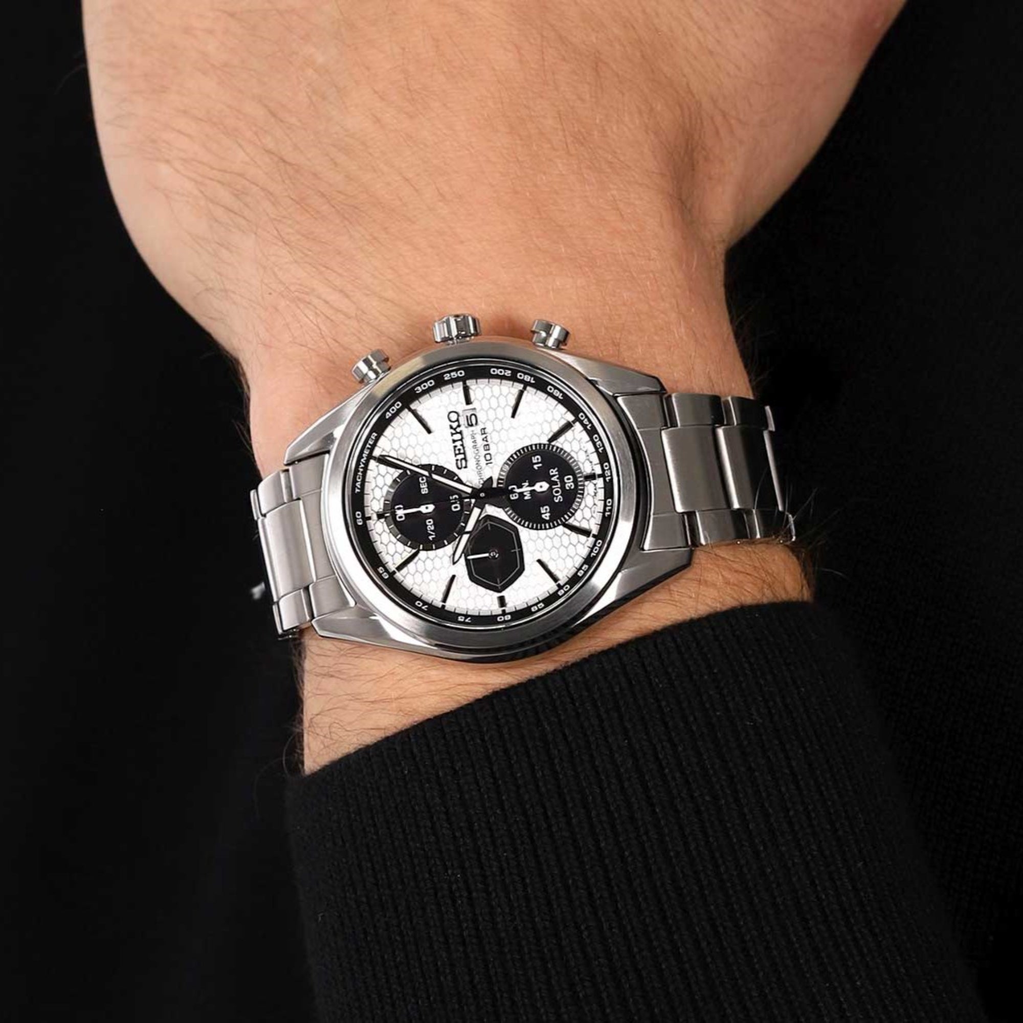 Seiko Essentials SSC769P1 solar chronograph watch on a mans wrist lifestyle view