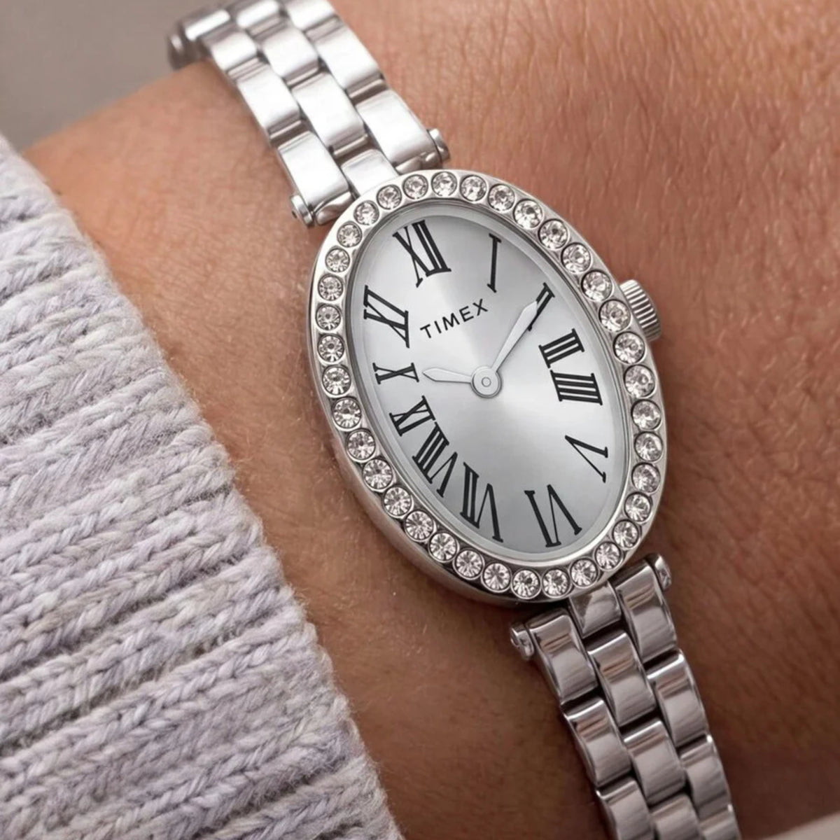 Timex Trend Cavatina TW2Y90000 wrist view showing a silver dial ladies watch styled on a person wearing a steel bracelet
