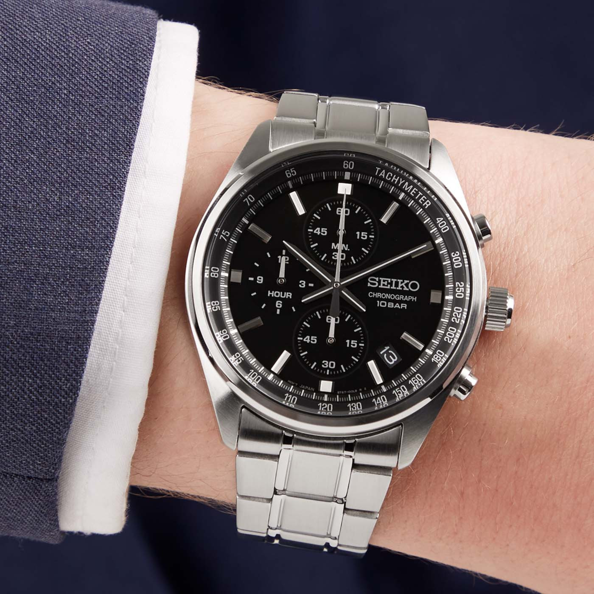 Seiko Essentials SSB379P watch with black dial and stainless steel bracelet on wrist