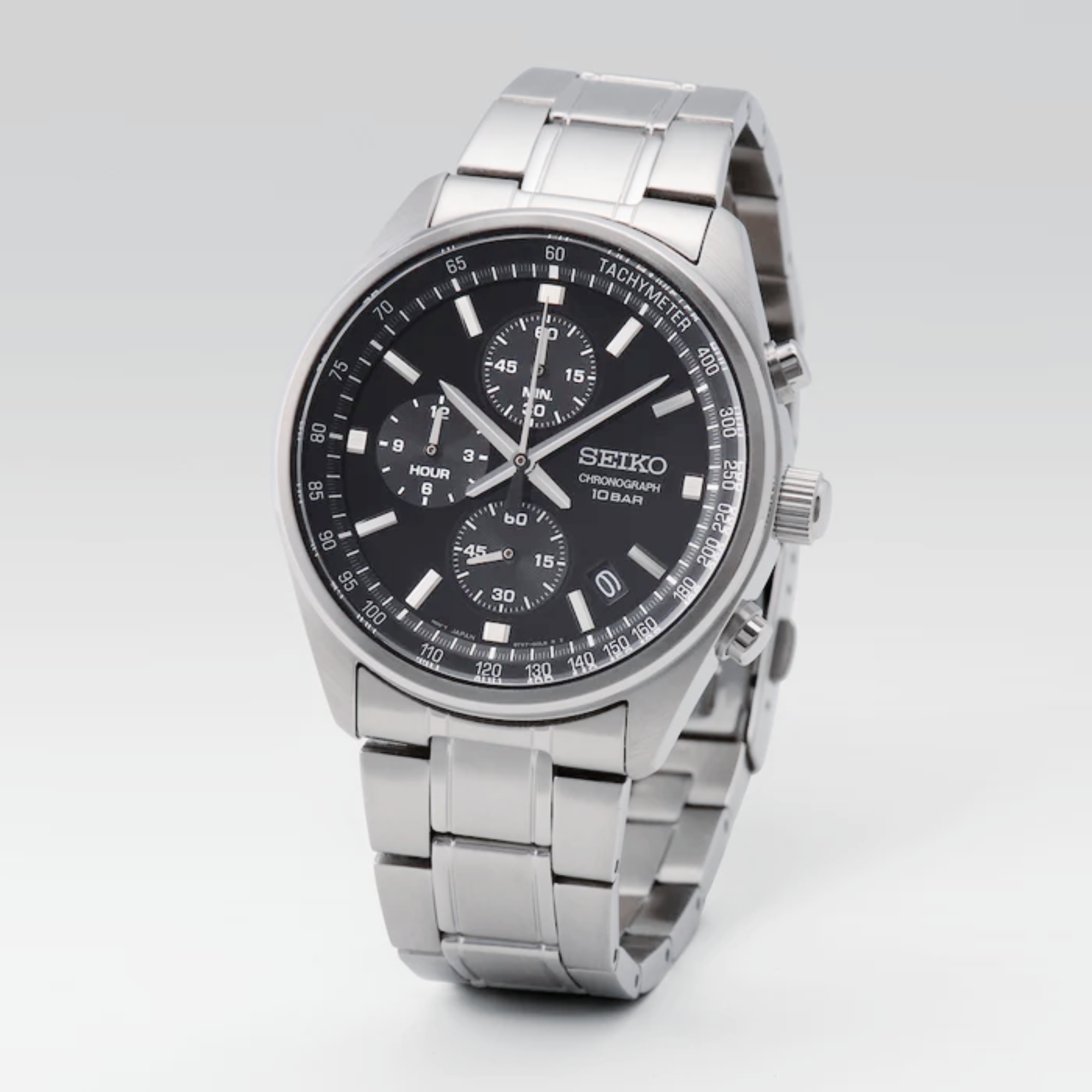 Seiko Essentials SSB379P watch with black dial and stainless steel bracelet on a grey and white gradient background