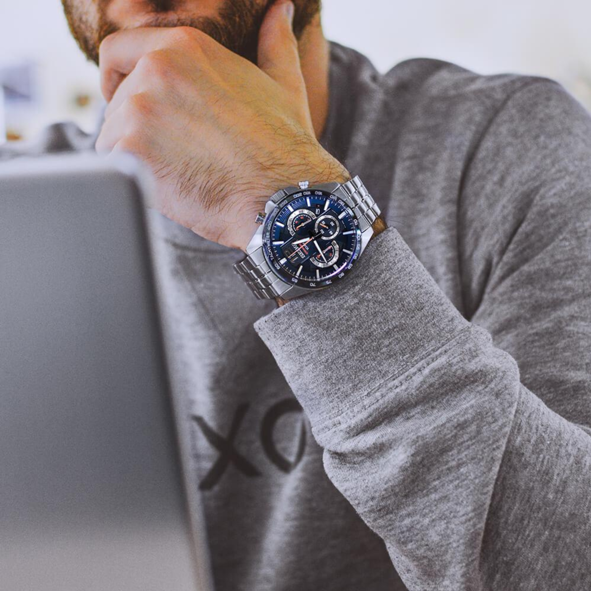 Seiko SSB345P1 blue dial chronograph watch worn on wrist with stainless steel bracelet