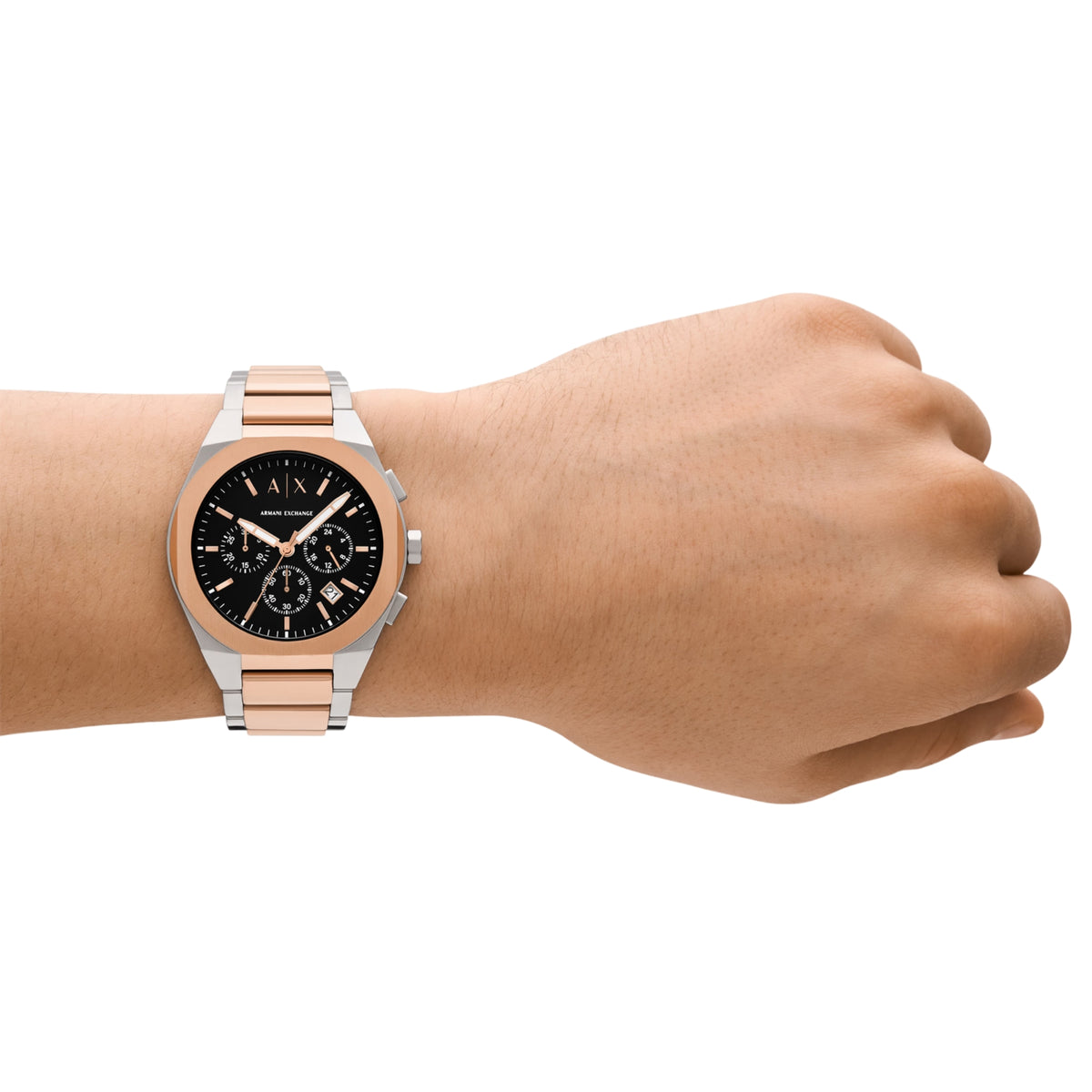 Mens chronograph watch on wrist with black dial and rose gold/steel bracelet