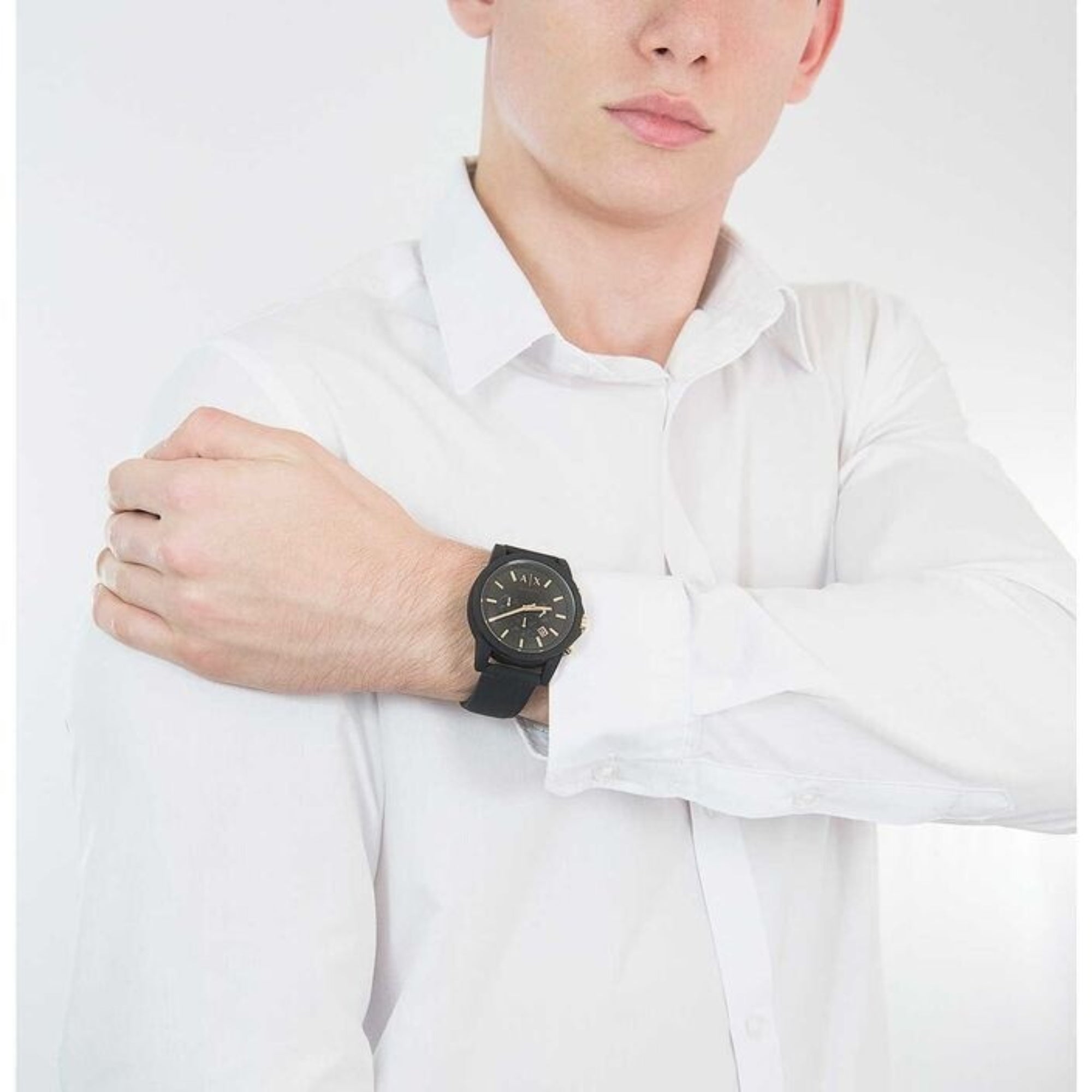 Man wearing Armani Exchange Outerbanks 45mm Chronograph Black Dial Silicone Mens Quartz Watch AX7105 with smart casual outfit.