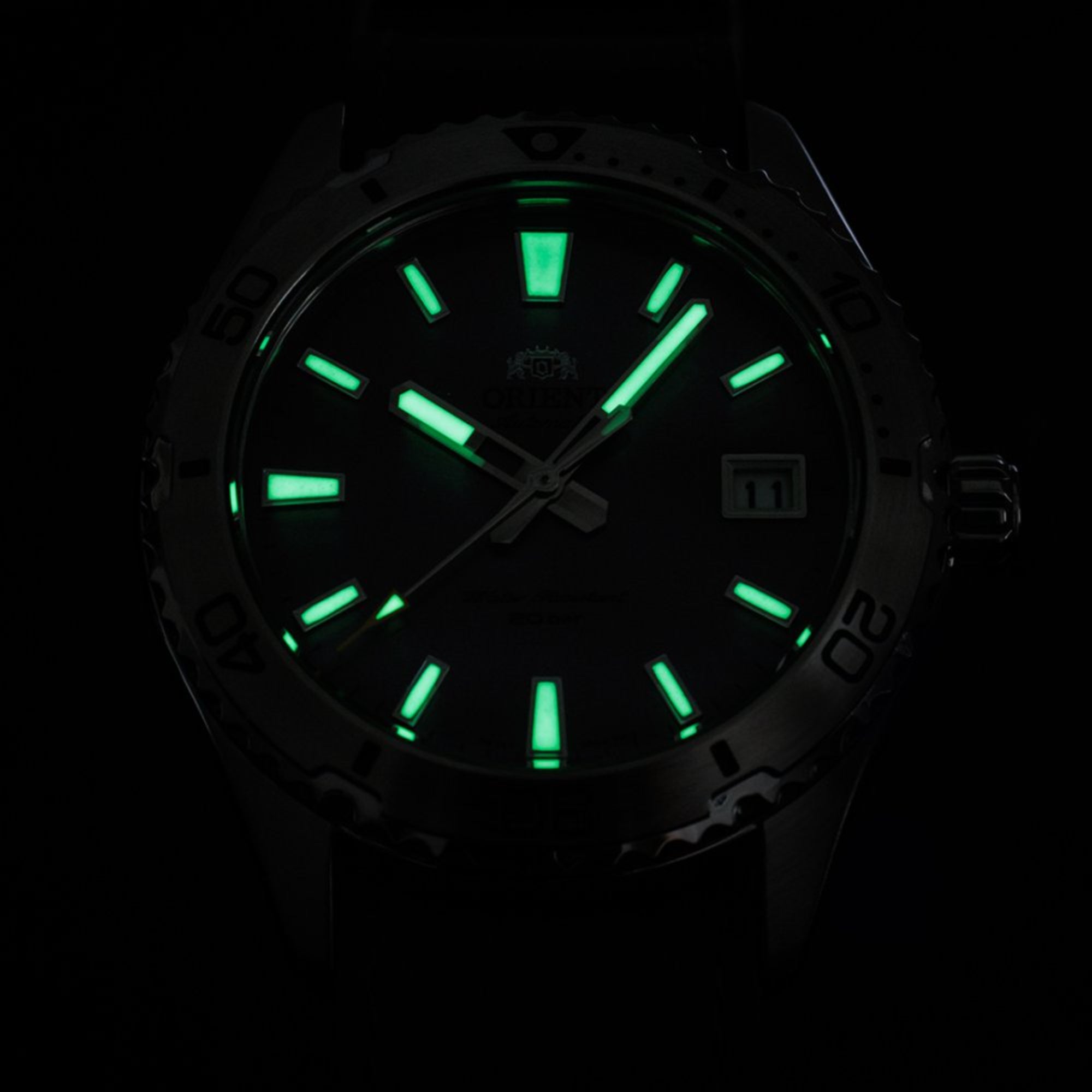 Orient Mako RA-AC0Q07V30B unidirectional rotating bezel and face at night