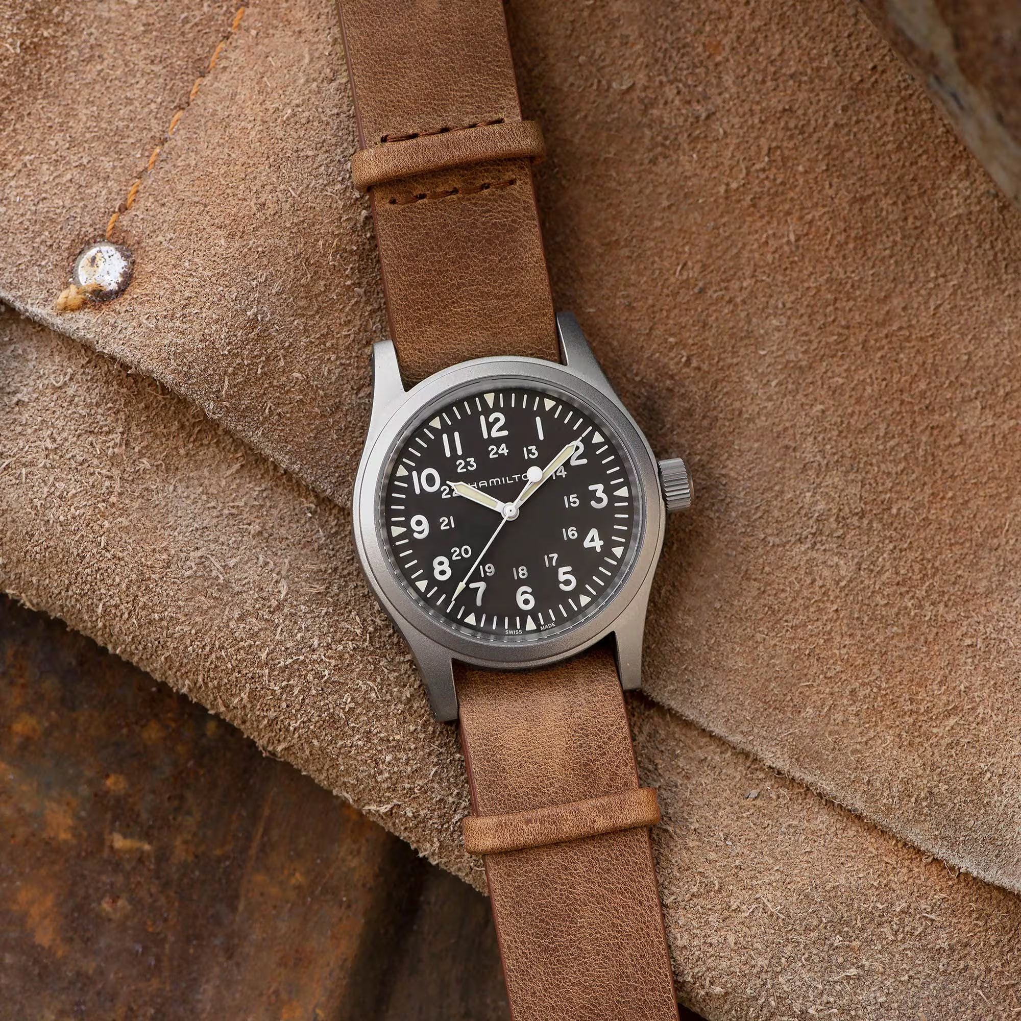 Hamilton Khaki Field 38mm black dial leather mechanical watch on brown leather background