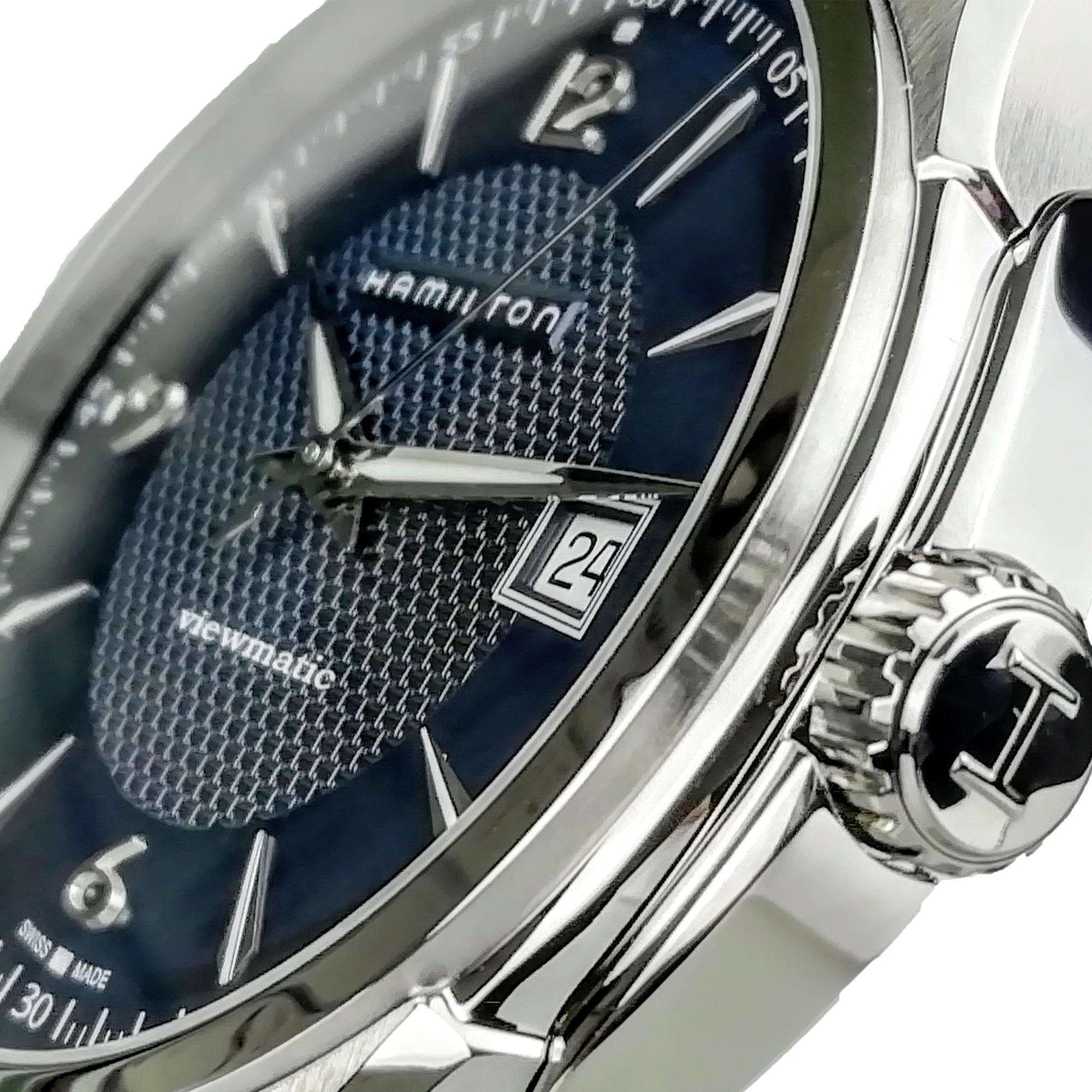 Close-up of a Hamilton watch with a blue face and silver case.