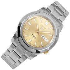 Seiko 5 Automatic watch SNKK13K1 featuring a gold dial, day-date window, and a stainless steel case and link bracelet