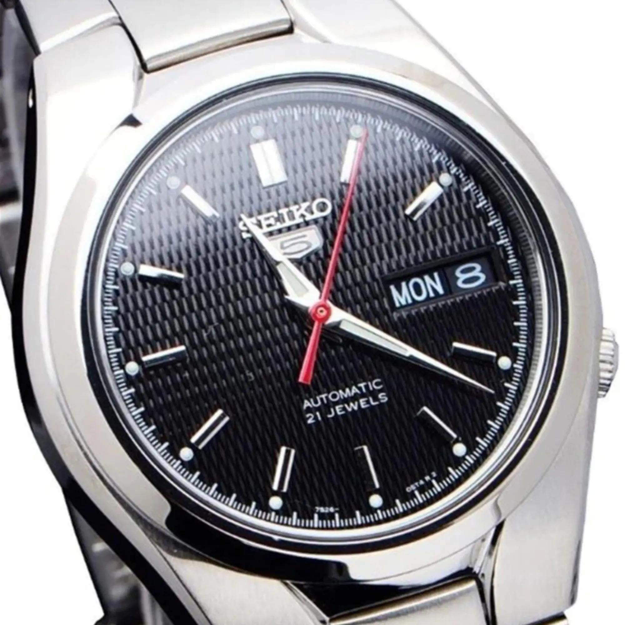 Seiko 5 38mm automatic black dial stainless steel watch close-up