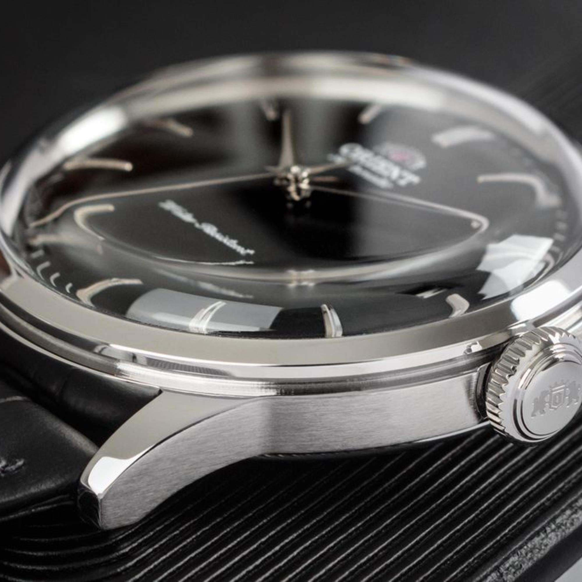 Orient RA-AC0M02B10B stainless steel case, signed crown, and domed crystal detail