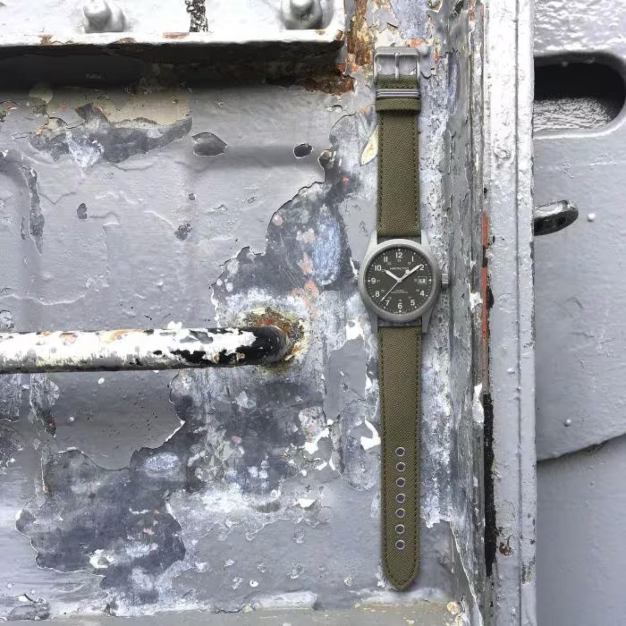 Hamilton Khaki Field 38mm H69439363 Mechanical watch with a green dial and green canvas strap.