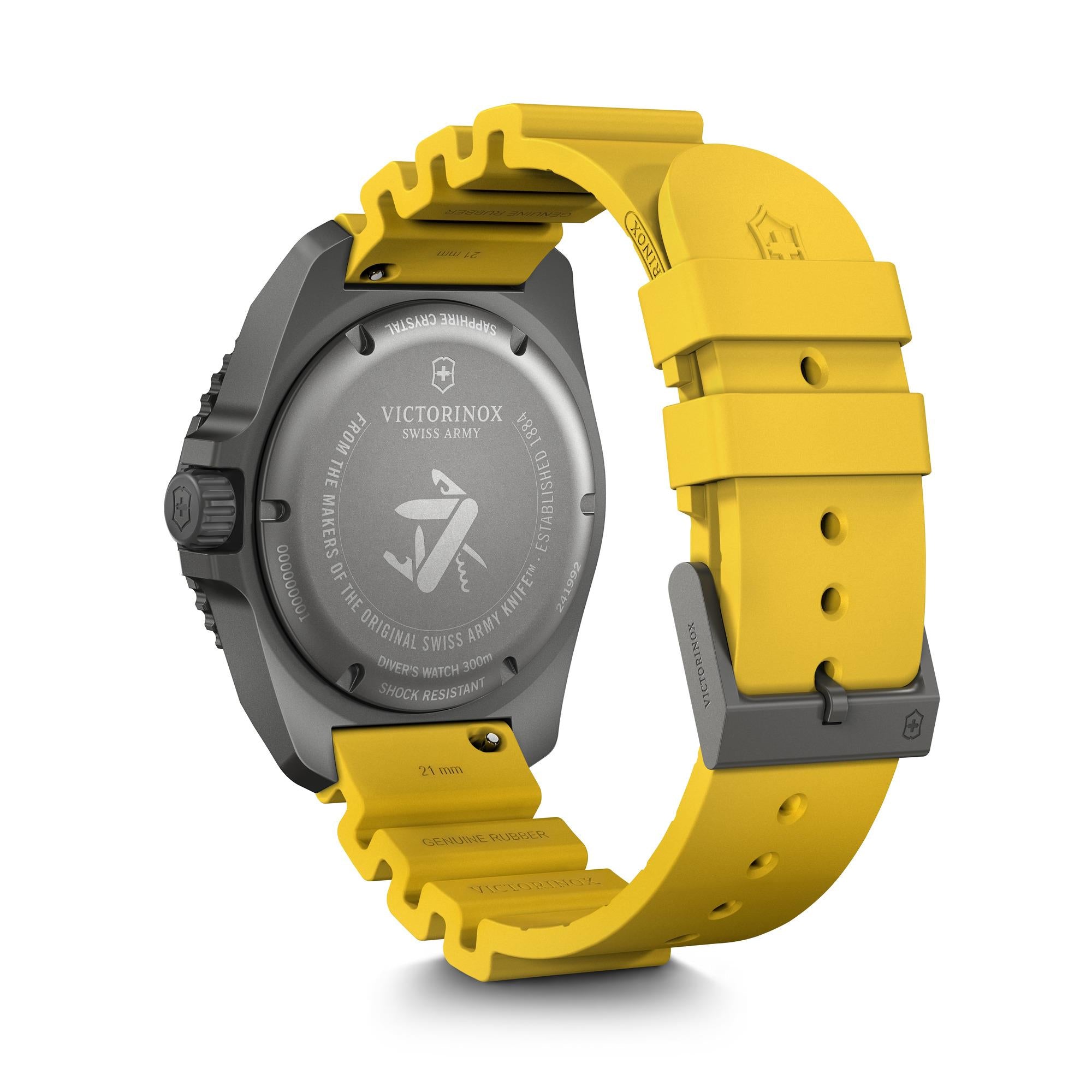 The caseback view of a dark grey Victorinox Dive Pro 43mm, featuring a solid engraved backing and a bright yellow rubber strap