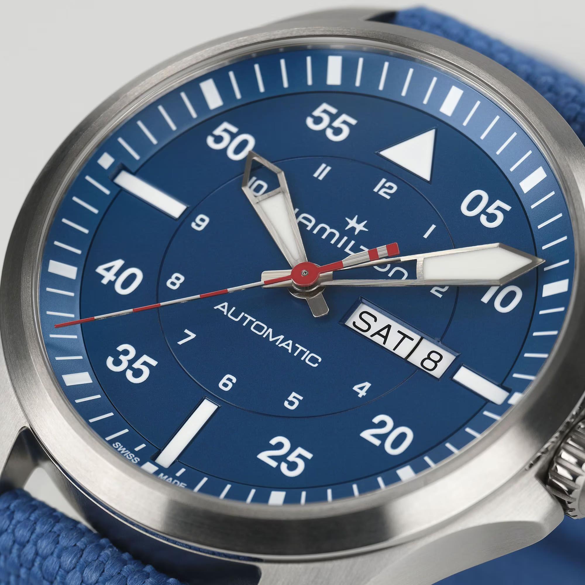 Hamilton H64655941 blue dial with day-date display at 3 o'clock and Arabic numerals close-up