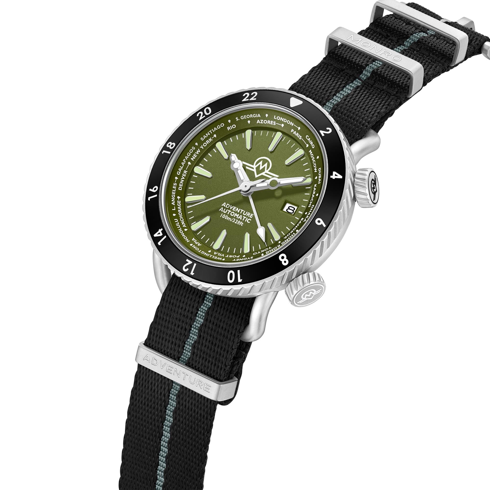 Monro Adventure MA-4 watch with striped fabric strap, dual crowns, and world time bezel angled view