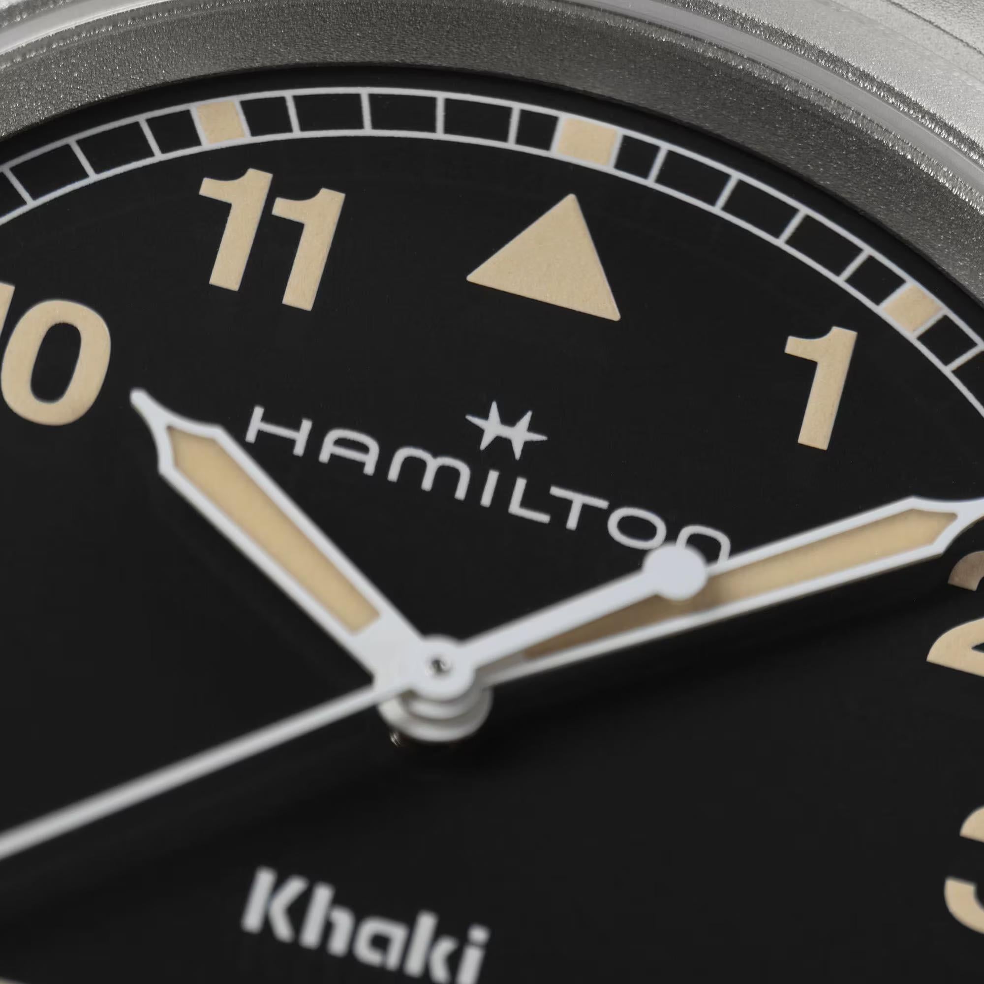 Hamilton Khaki Field H69401131 black dial with Arabic numerals and luminous hands close-up