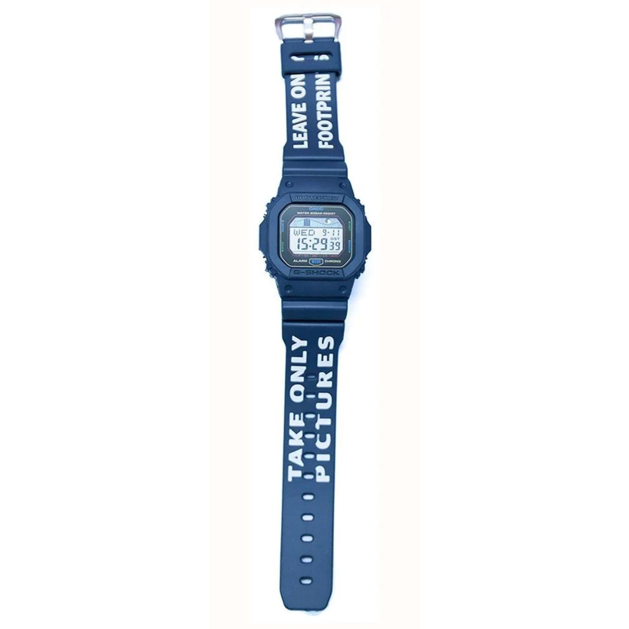 Blue digital watch with text on the strap against a white background