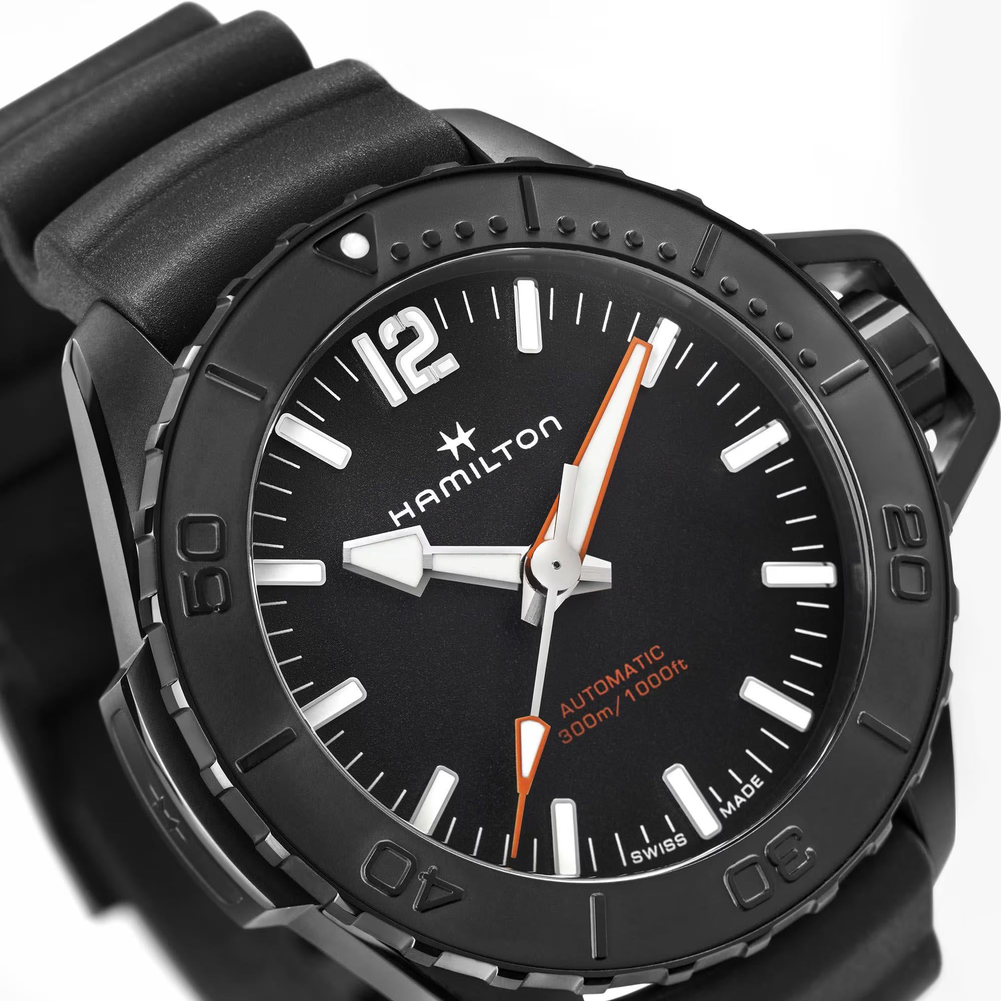 Close-up of the Hamilton Khaki Navy mens automatic watch H77855330 dial, highlighting the black textured face and white indices