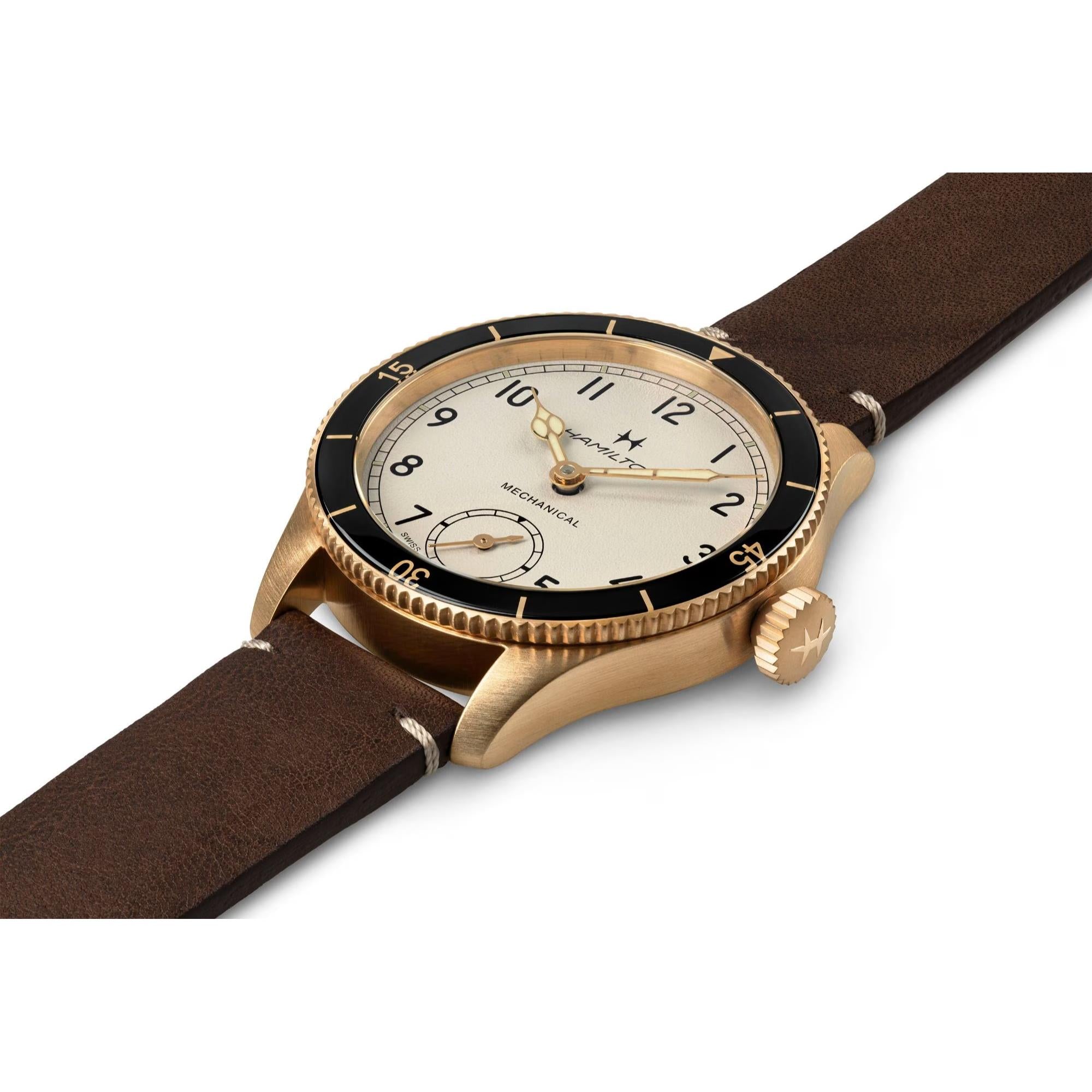 Hamilton Khaki Aviation H76709510 Pioneer mechanical watch with a bronze case and brown leather strap.