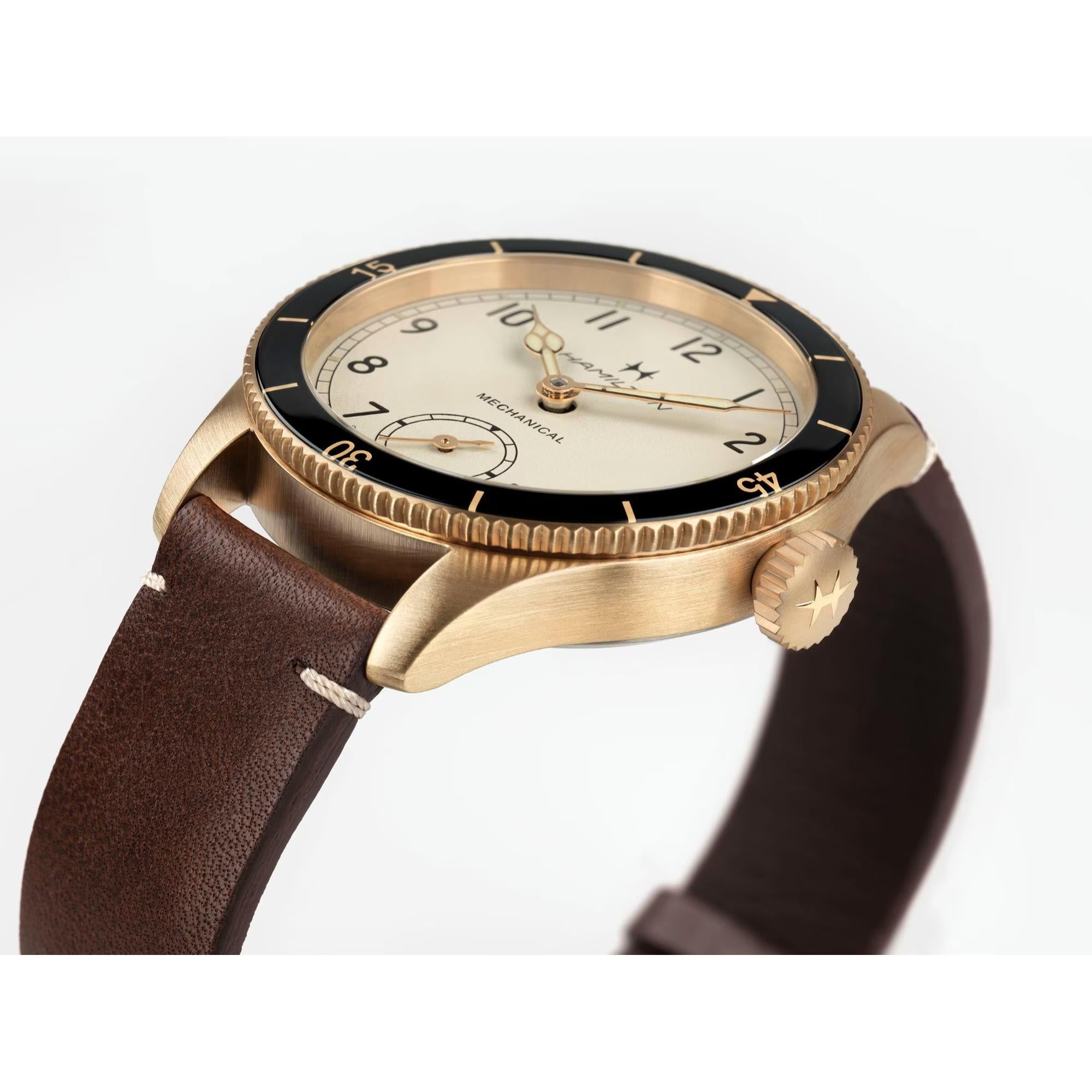 Hamilton Khaki Aviation Pioneer mechanical watch with a bronze case and brown leather strap.
