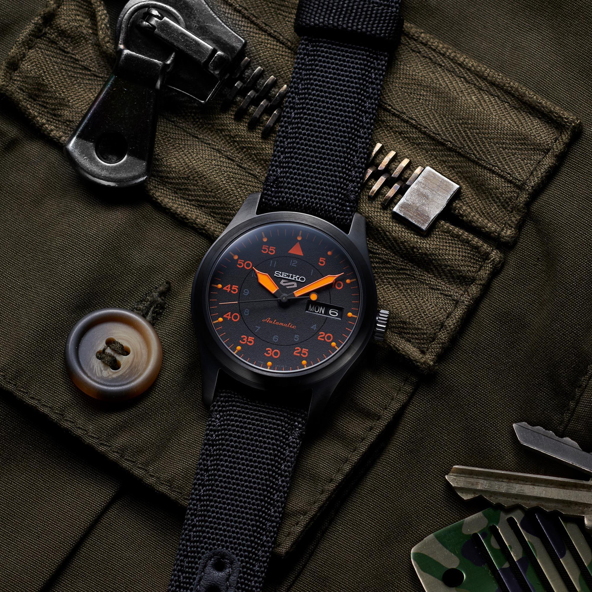 Seiko 5 Flieger Pilot/Aviation Style Automatik Schwarz und Orange Zifferblatt Canvas Armband Herren Uhr SRPH33K1
