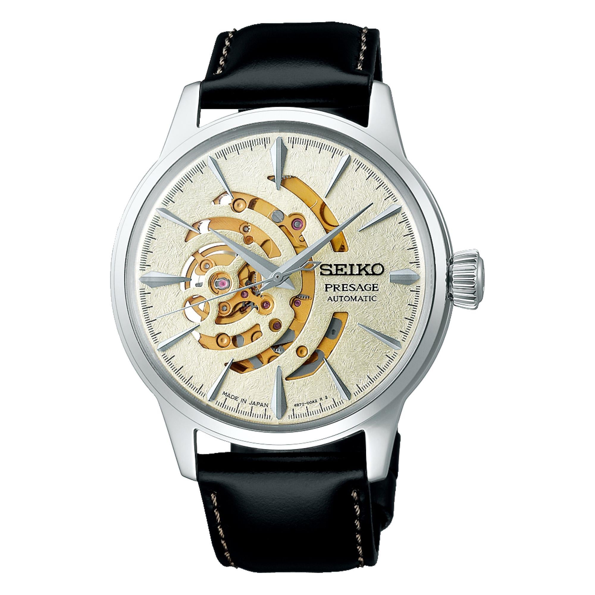 Seiko watch with black leather strap and visible mechanical components on a white background