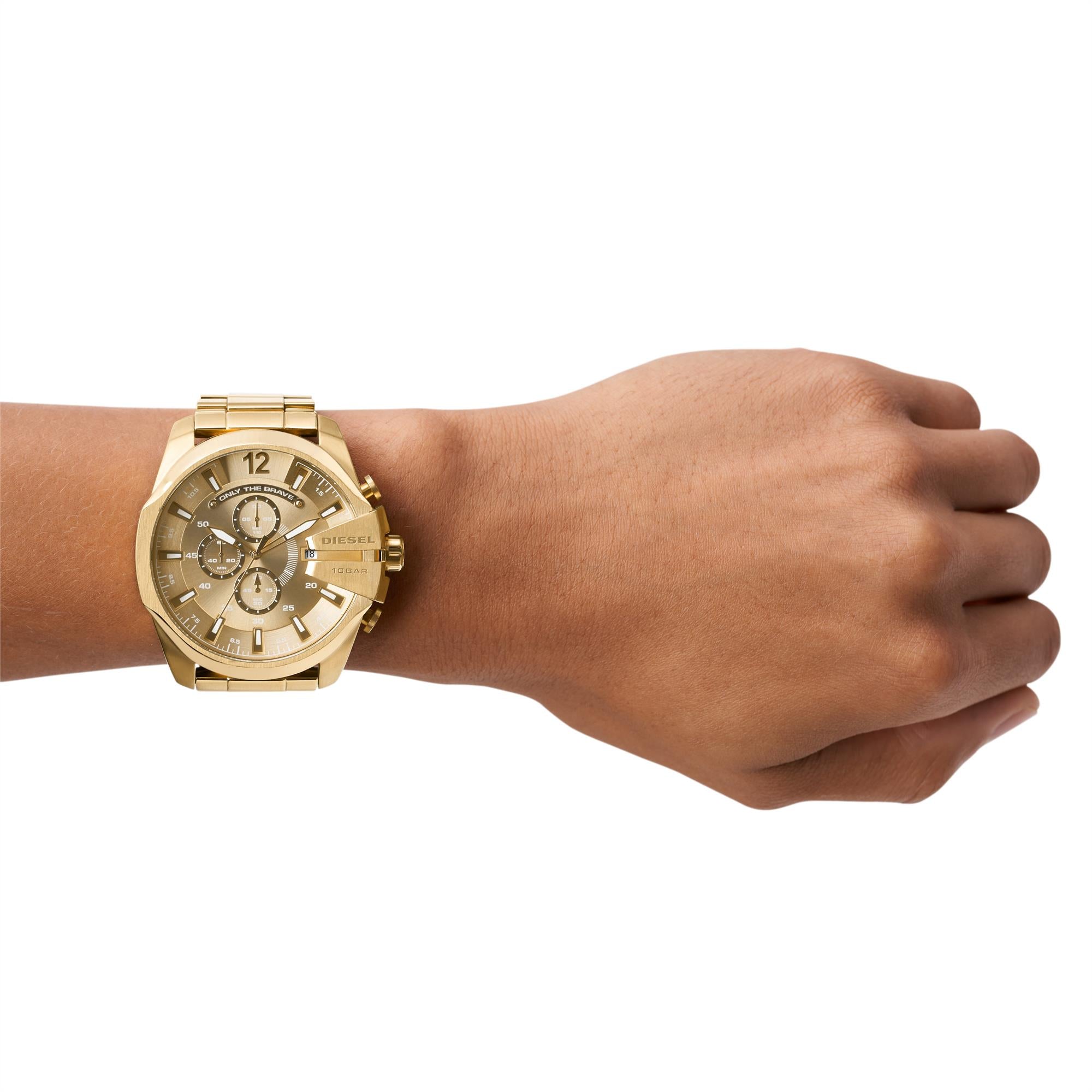 Gold wristwatch on a wrist with a white background