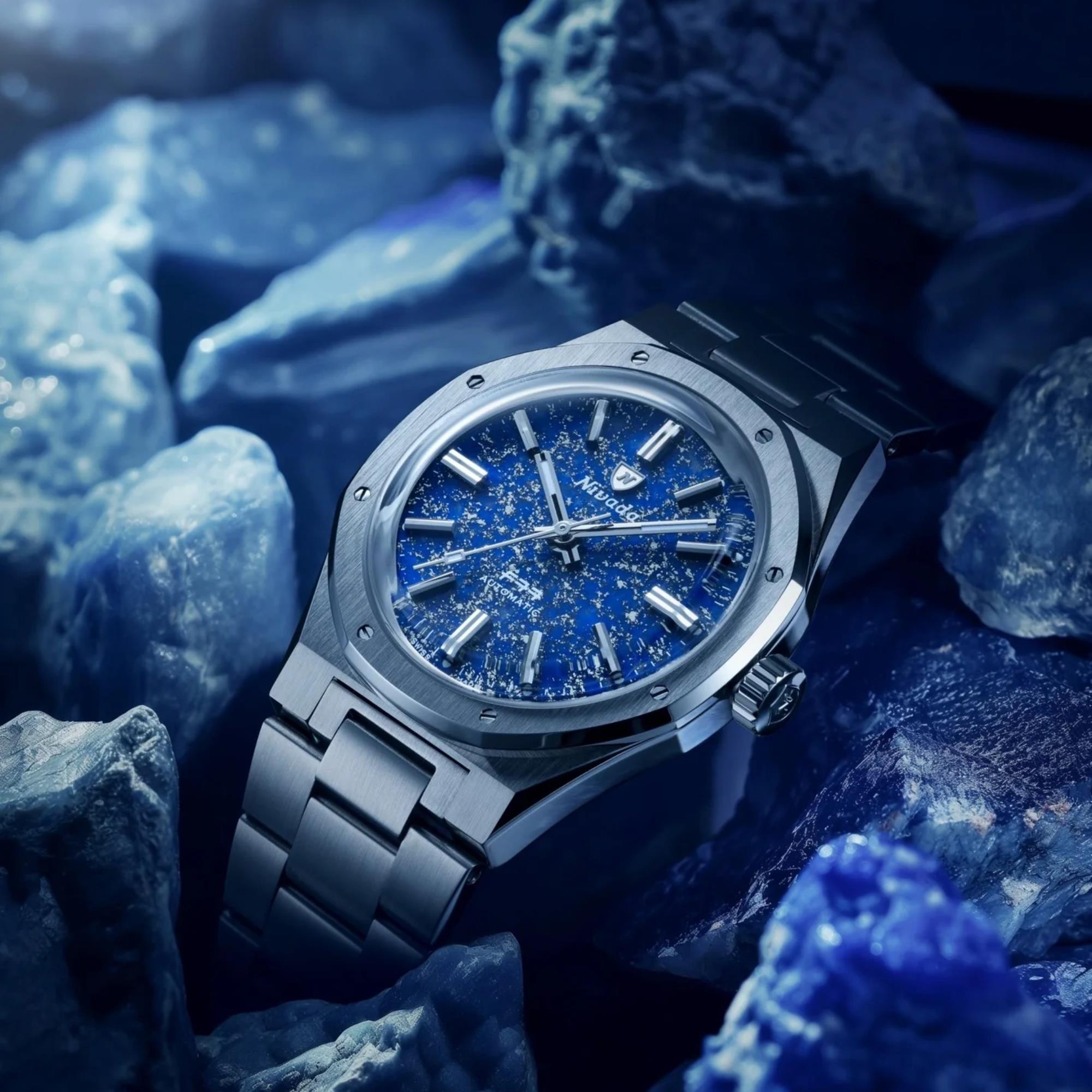 Nivada Grenchen F77 MK1 68009A77 watch resting on raw lapis lazuli rocks