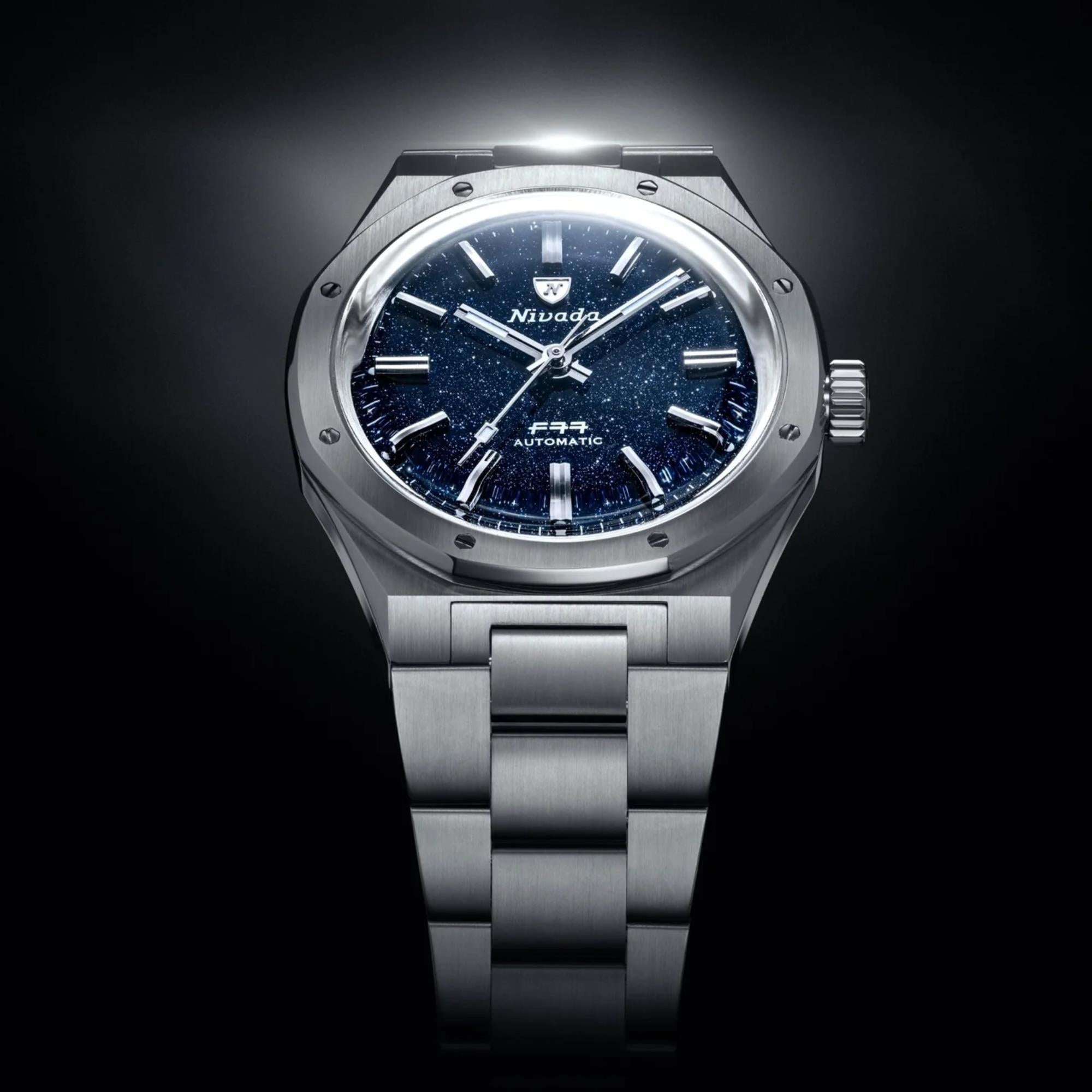 Nivada Grenchen F77 MK1 68010A77 dark blue dial overhead view with top lighting highlights