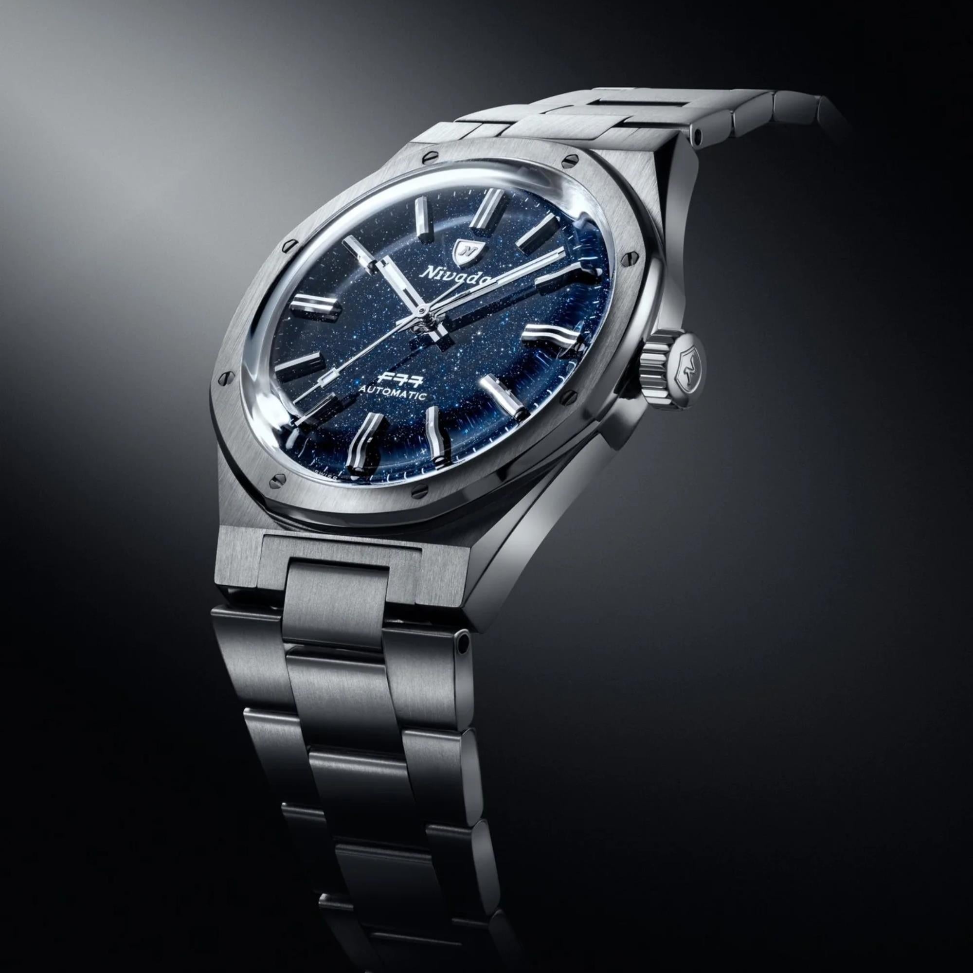 Nivada Grenchen F77 MK1 68010A77 dark blue dial angled presentation on black background