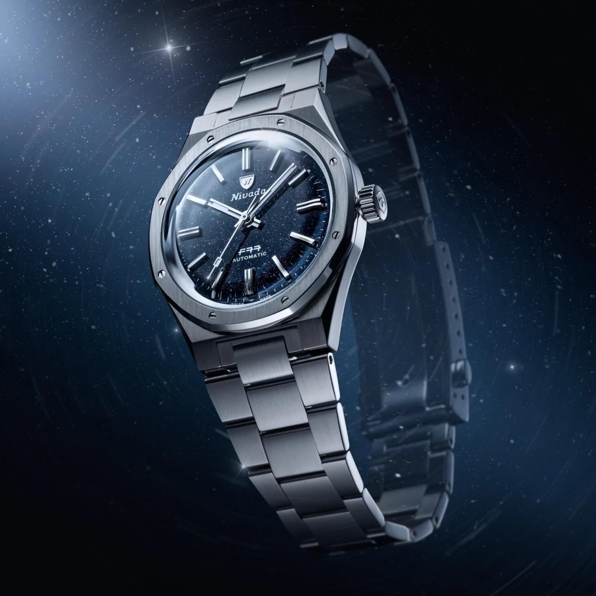 Nivada Grenchen F77 MK1 68010A77 dark blue dial floating dynamic angle view against a starry background