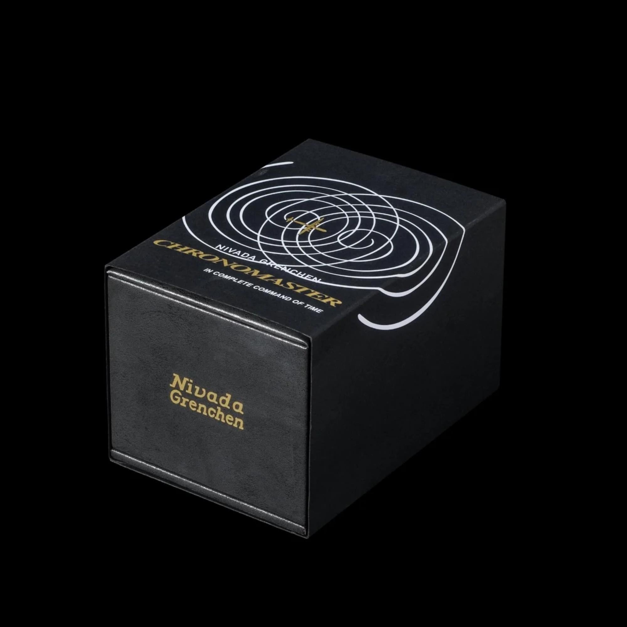 Nivada Grenchen Chronomaster 86011M01 outer sleeve packaging with gold typography and spiral graphic detail