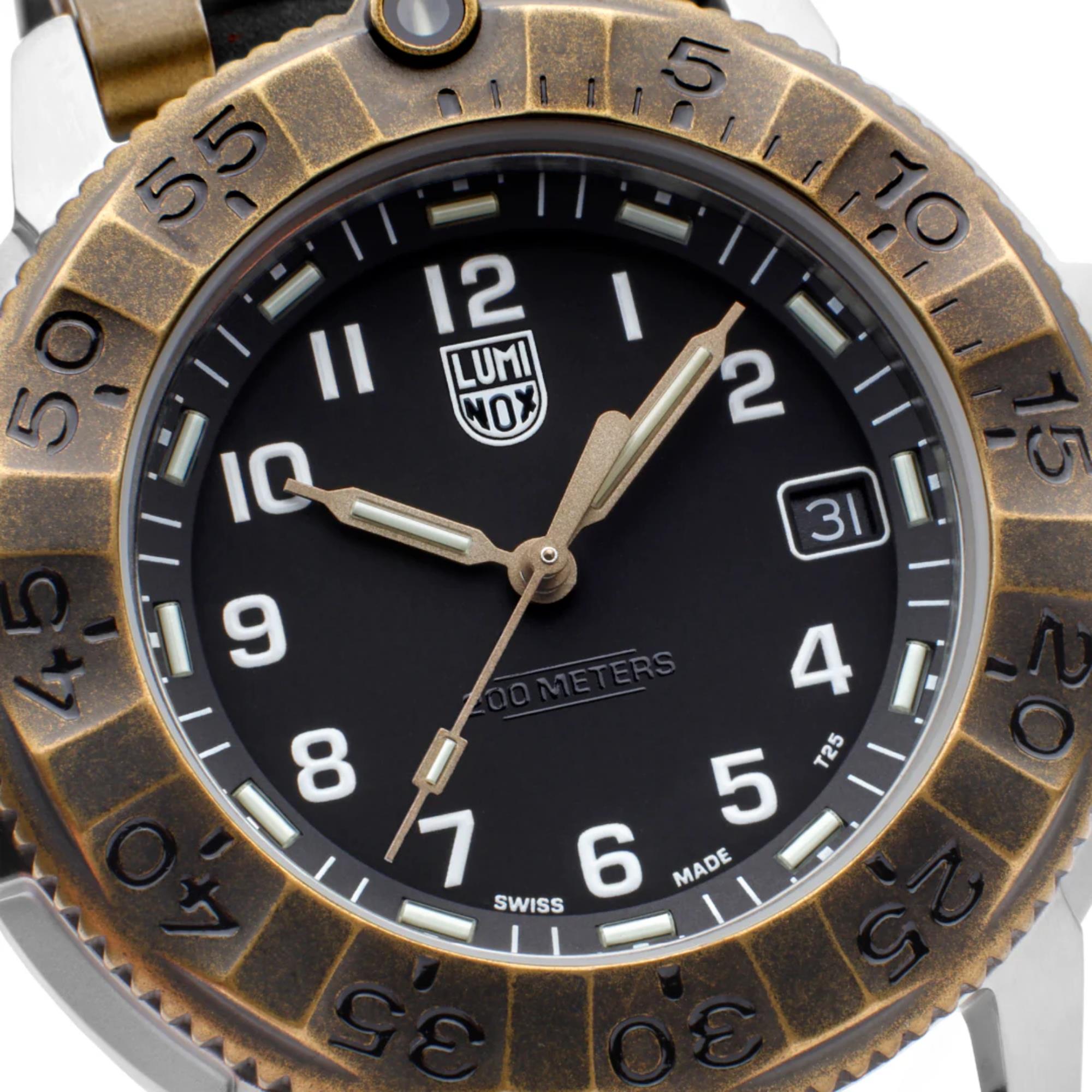 Close-up of the watch dial of the Luminox Adventure Watch XL.1301, showing the bronze bezel markings, white numerals, and date window