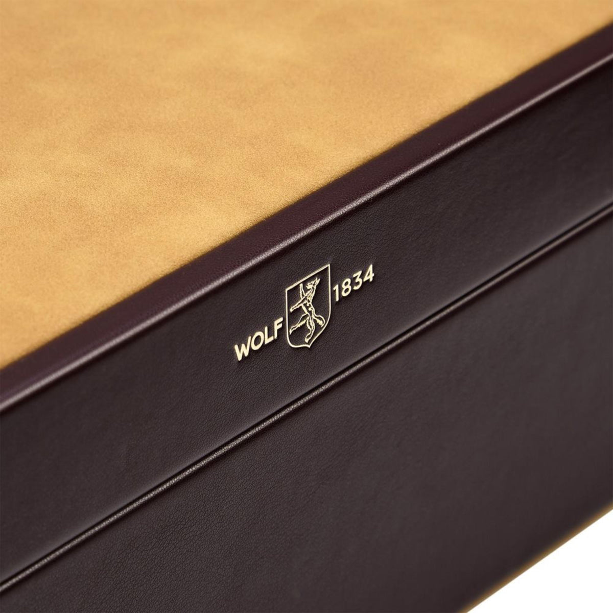 WOLF Philipp 190206 detail view highlighting gold stamped brand logo on chestnut leather edge