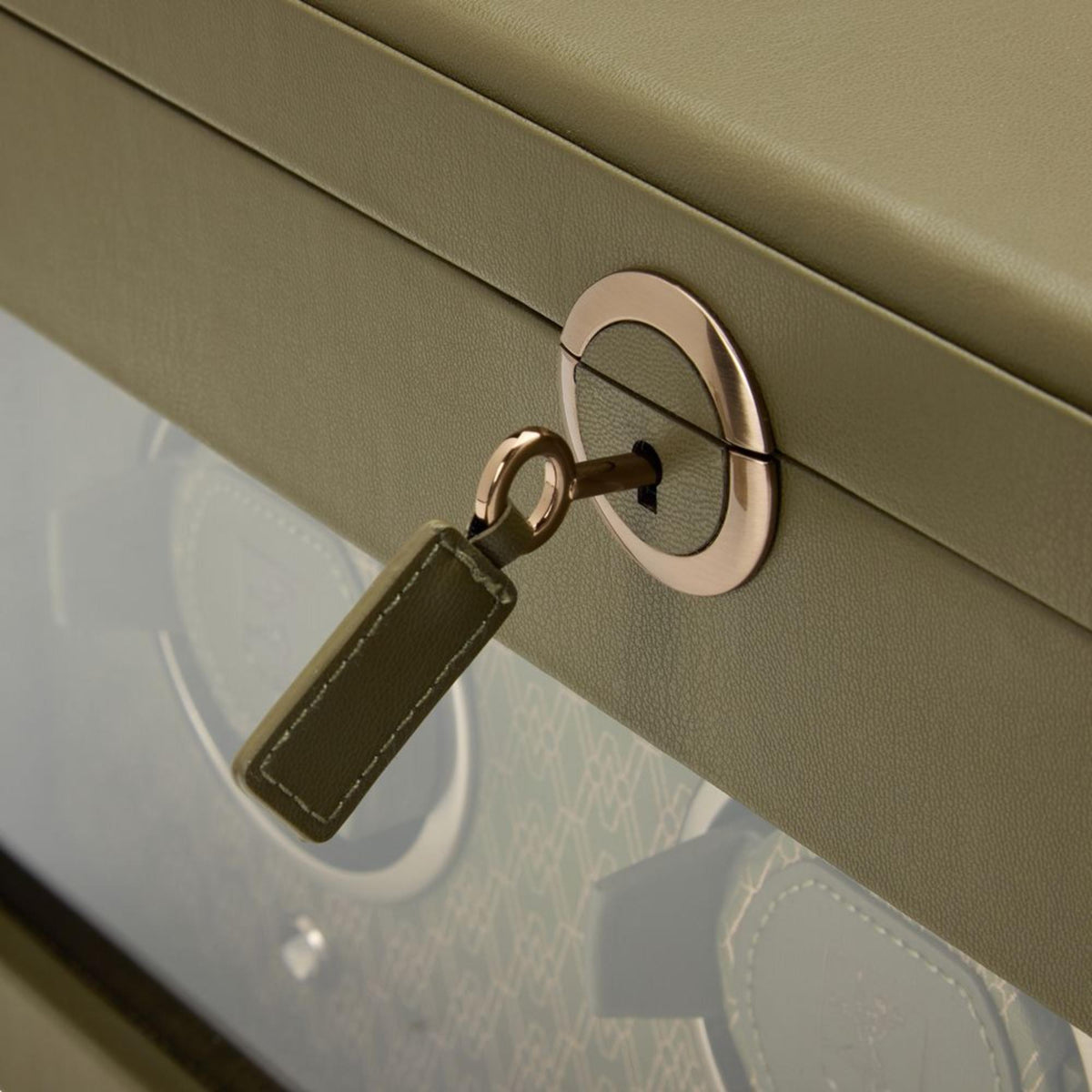 WOLF Earth 190th Anniversary 190541 macro detail shot of key with olive leather fob inserted into round front lock