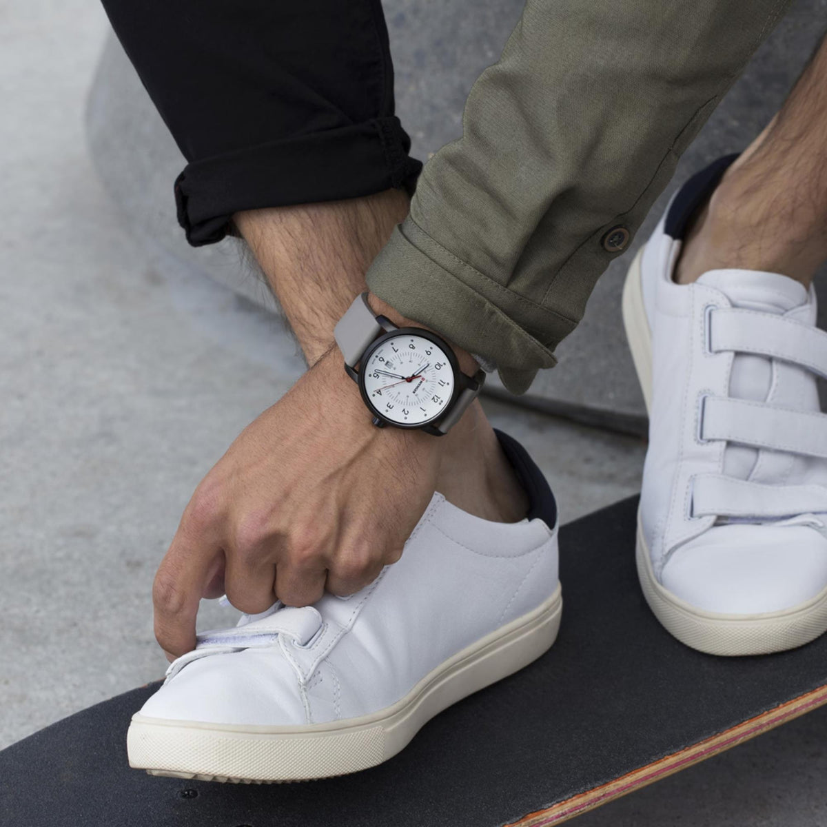 Wenger Avenue 01.1641.121 on-wrist shot showing white dial watch paired with grey silicone strap and causal attire
